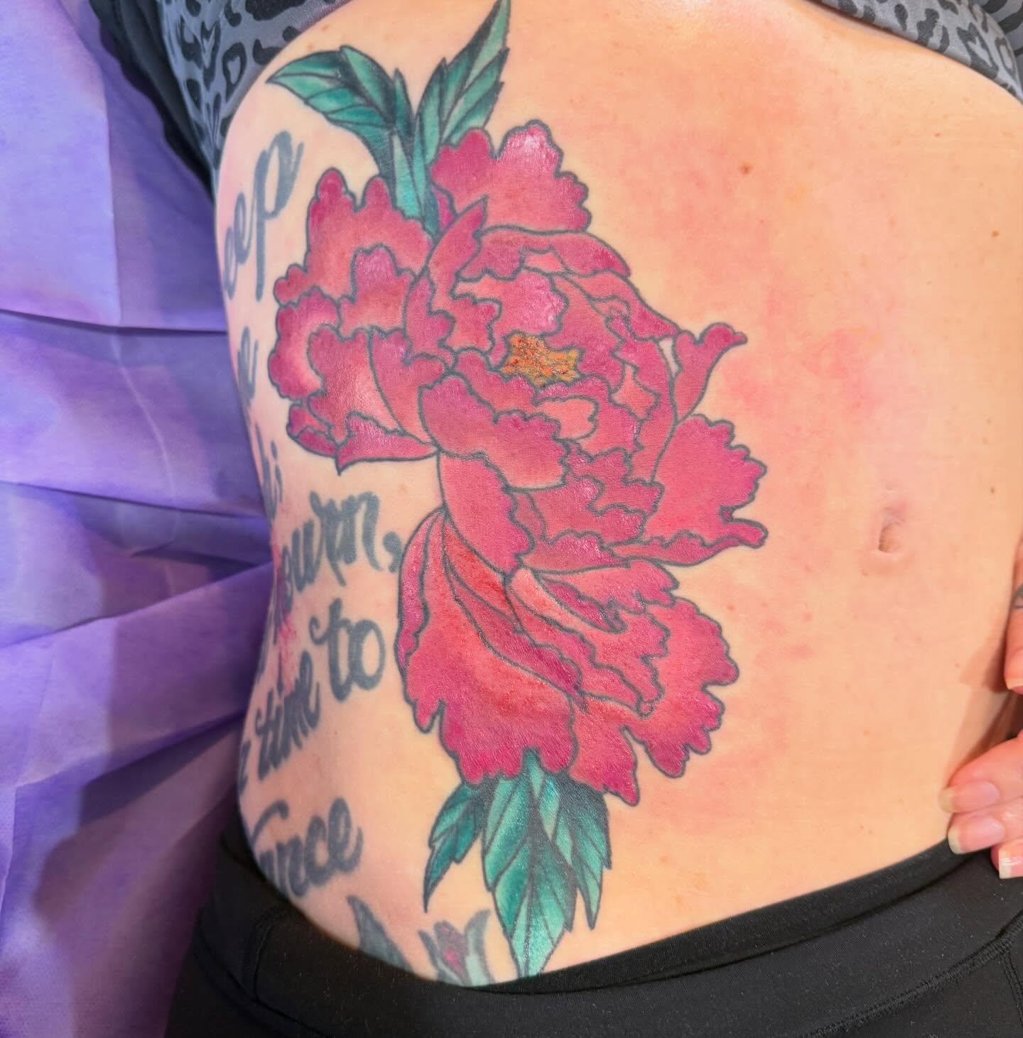 Peony new school tattoo on the torso by Laura Saadati Kepper