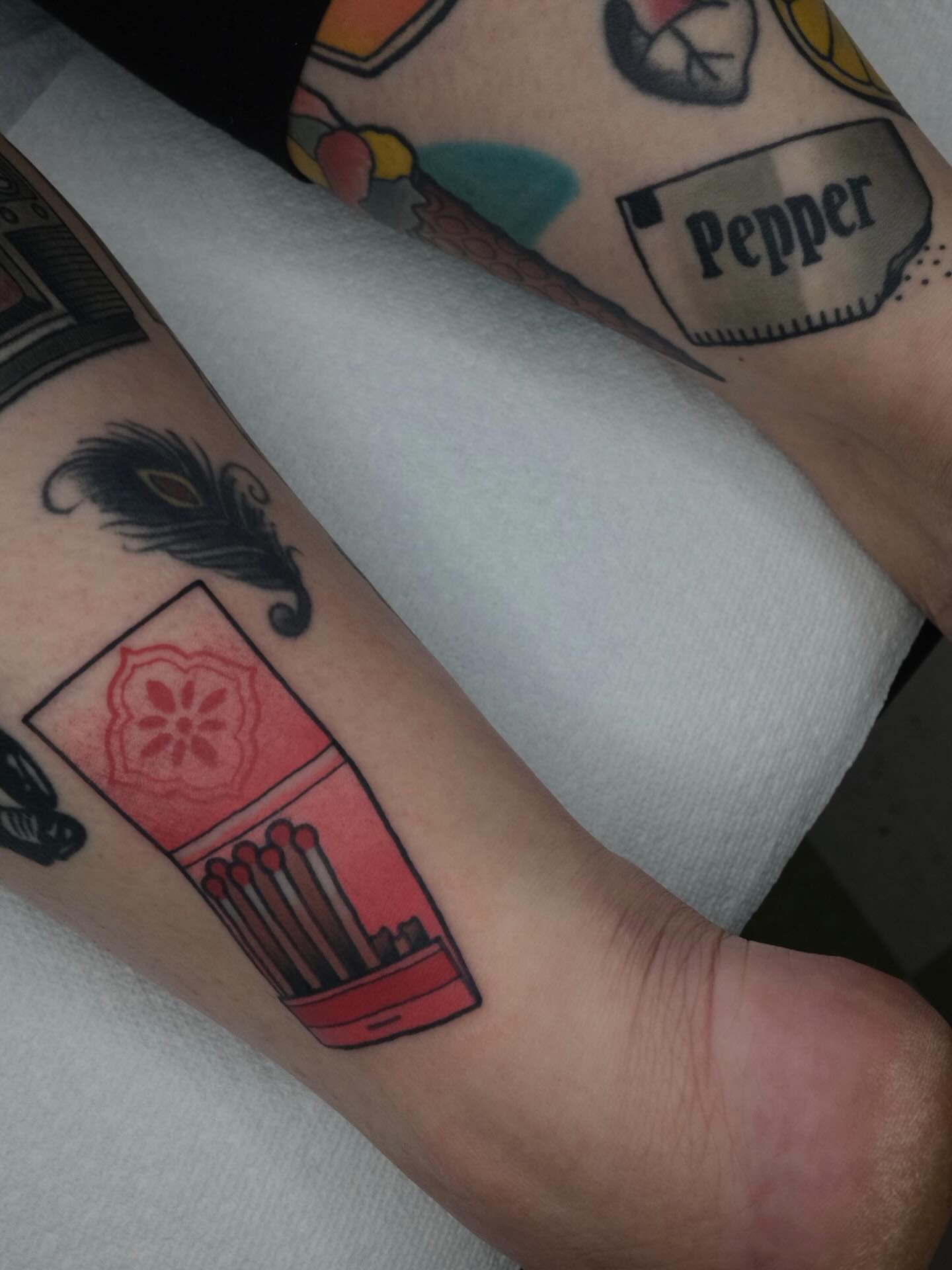 Matchbox American traditional tattoo on the forearm by James Maxwell