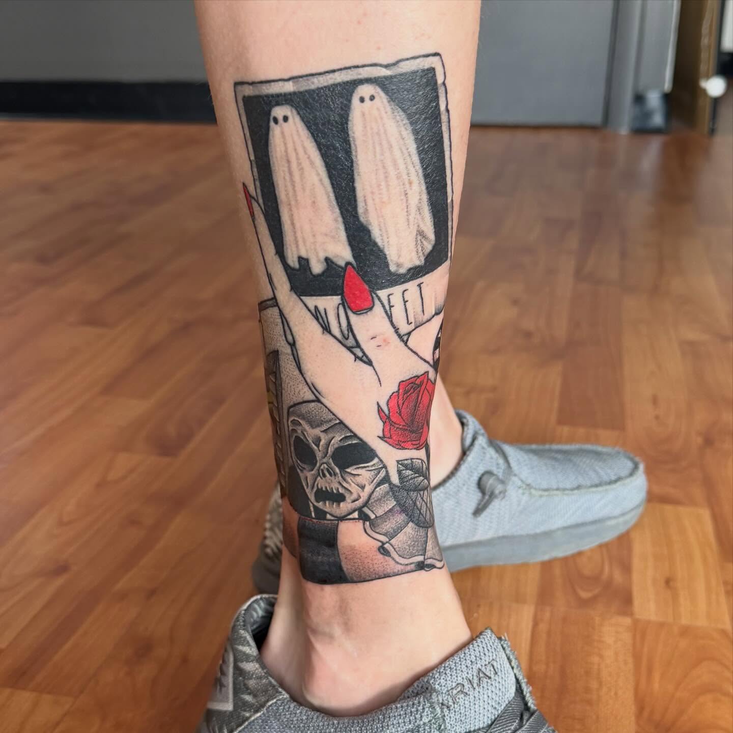 Ghosts and hand black and grey tattoo on the forearm by Matt Hattaway