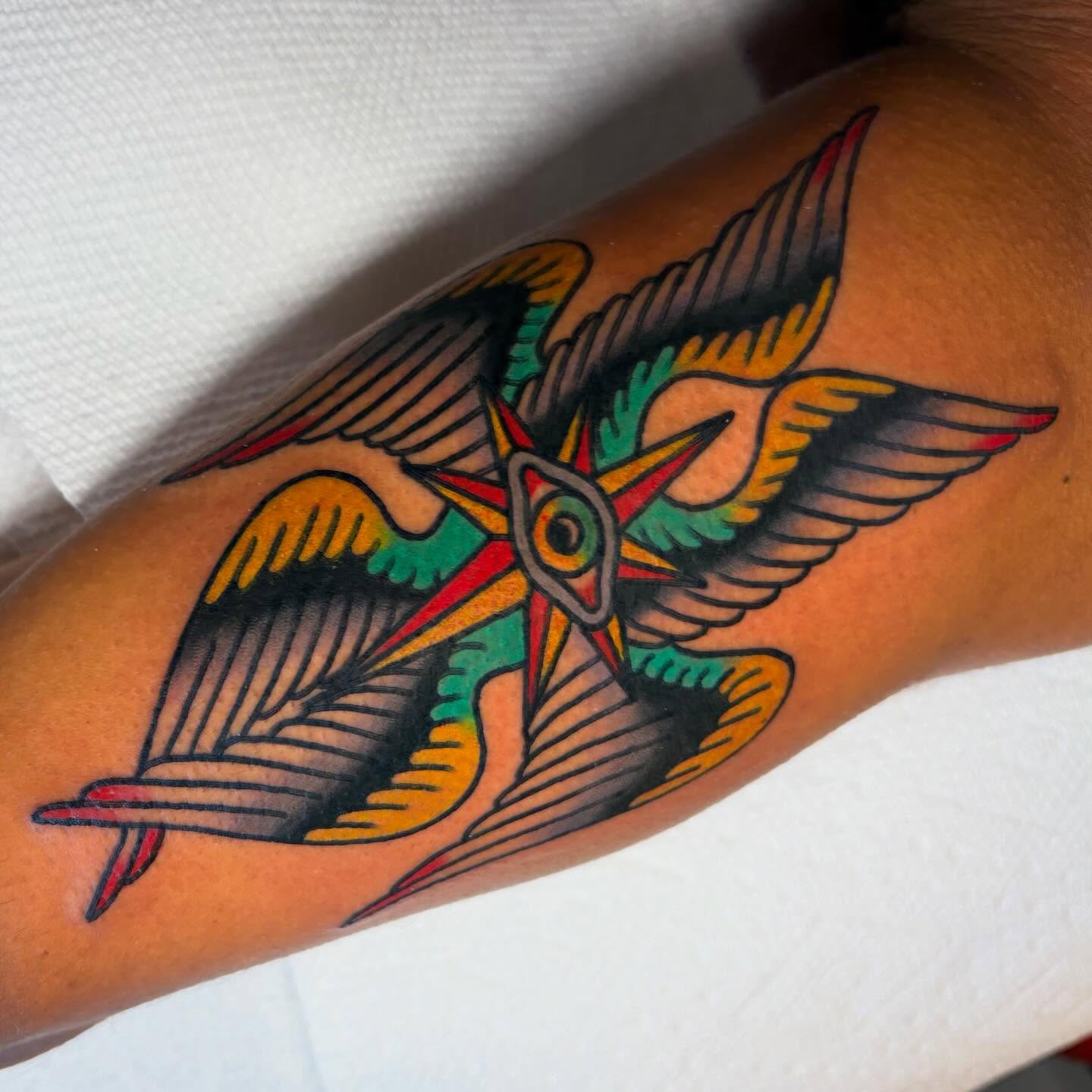 Bird American traditional tattoo on the forearm by Zoe Margot