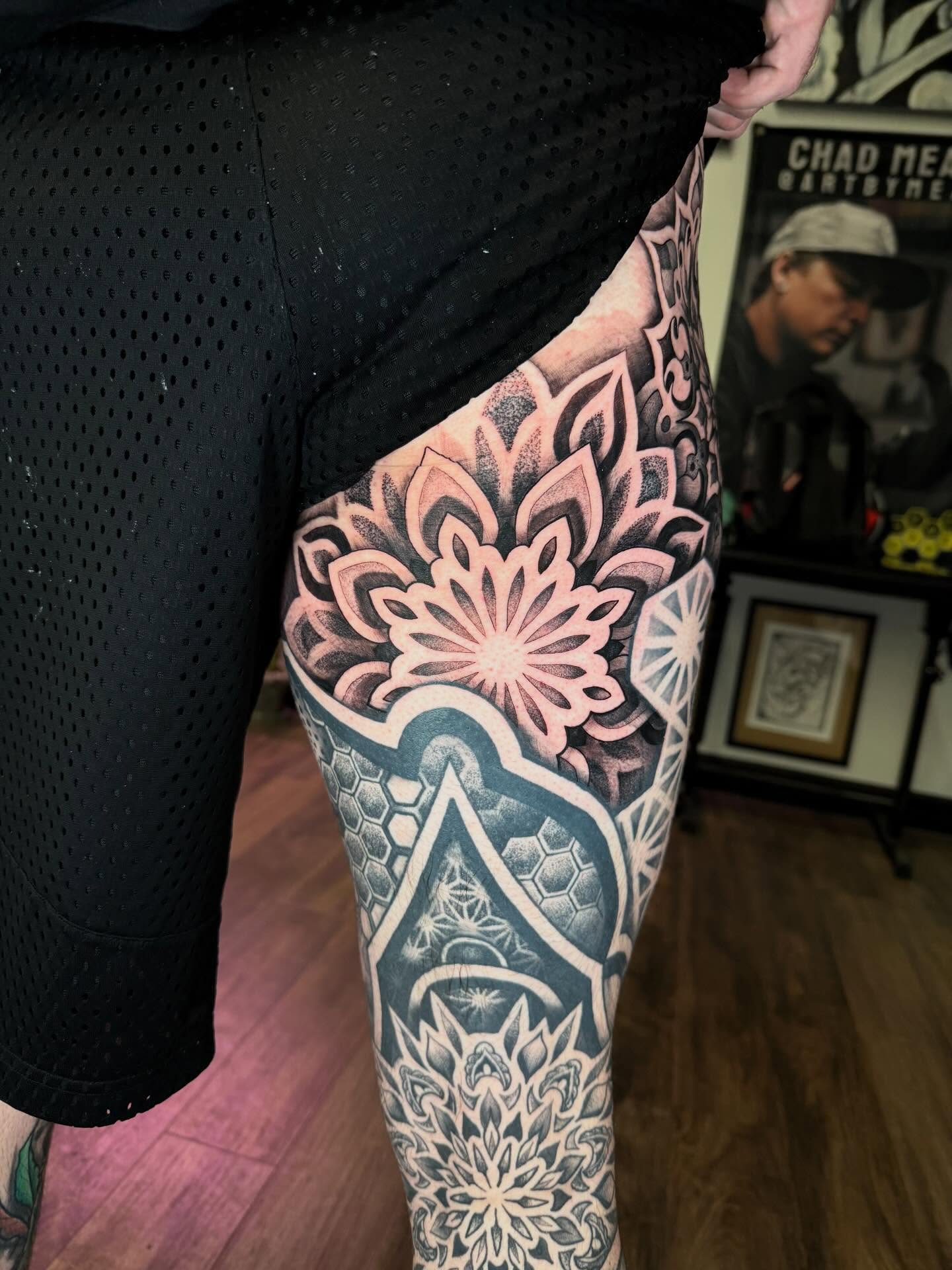 Mandala dotwork tattoo on the thigh by Chad Meado