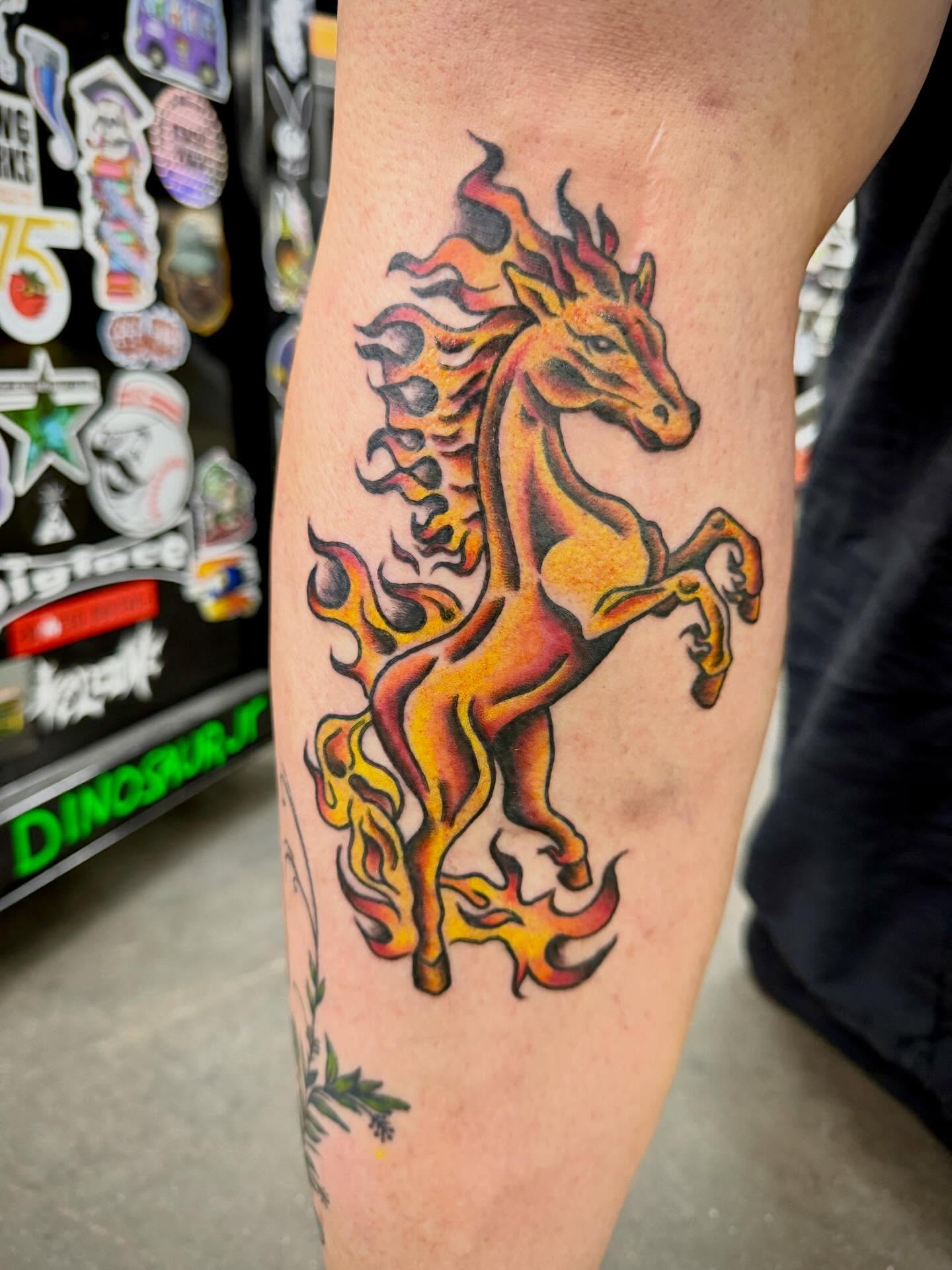 Flaming horse American traditional tattoo on the forearm by Ali Calis