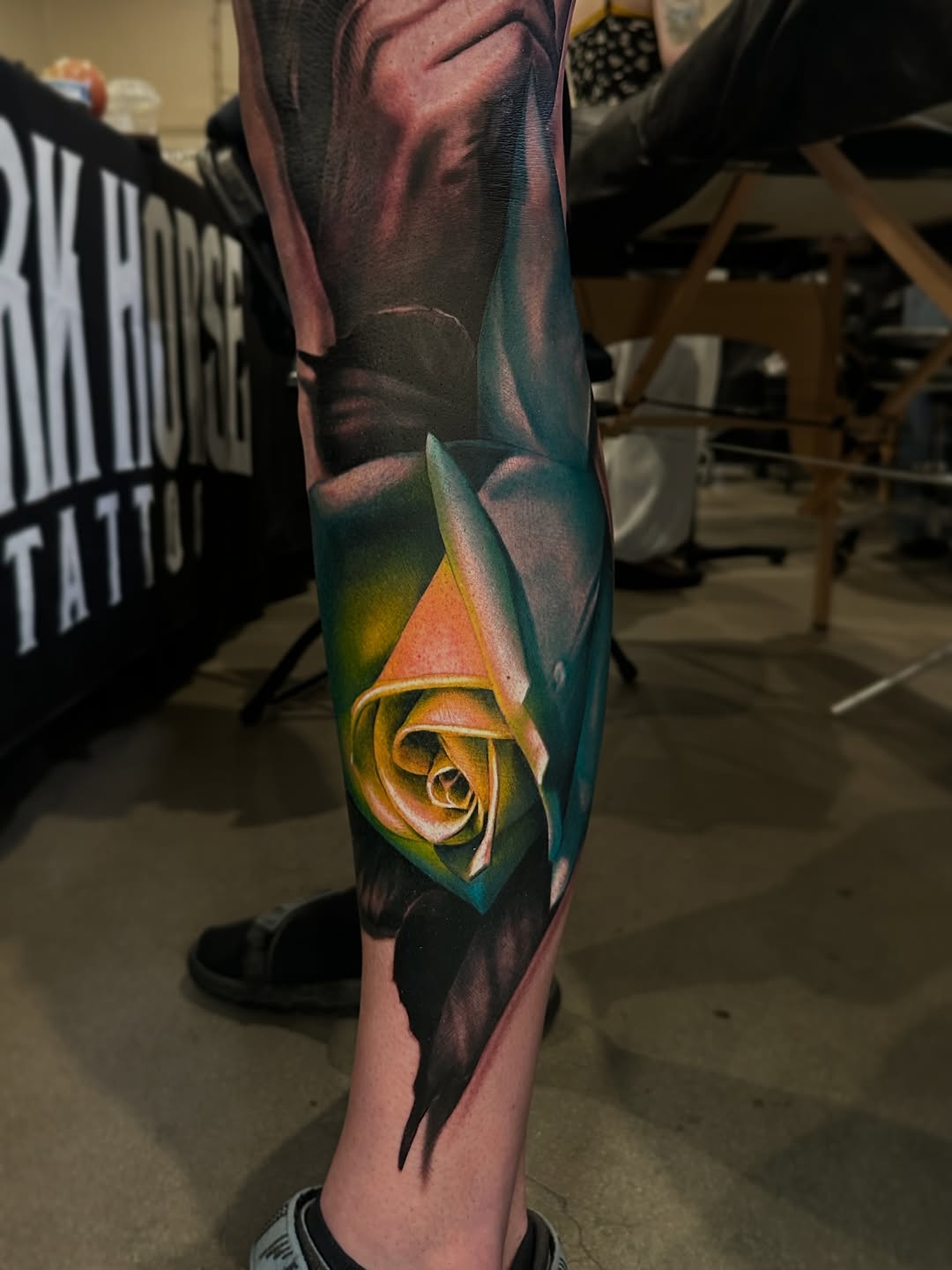 Yellow rose surrealism tattoo on the forearm by Dakota Case