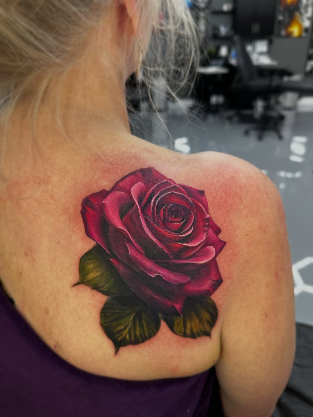 Red rose neo-traditional tattoo on the shoulder by Dakota Case