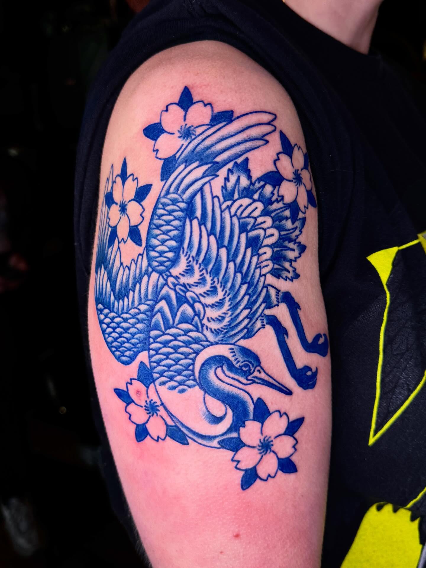Crane and cherry blossoms japanese irezumi tattoo on the upper arm by Meg Nefcy, Milford, Michigan