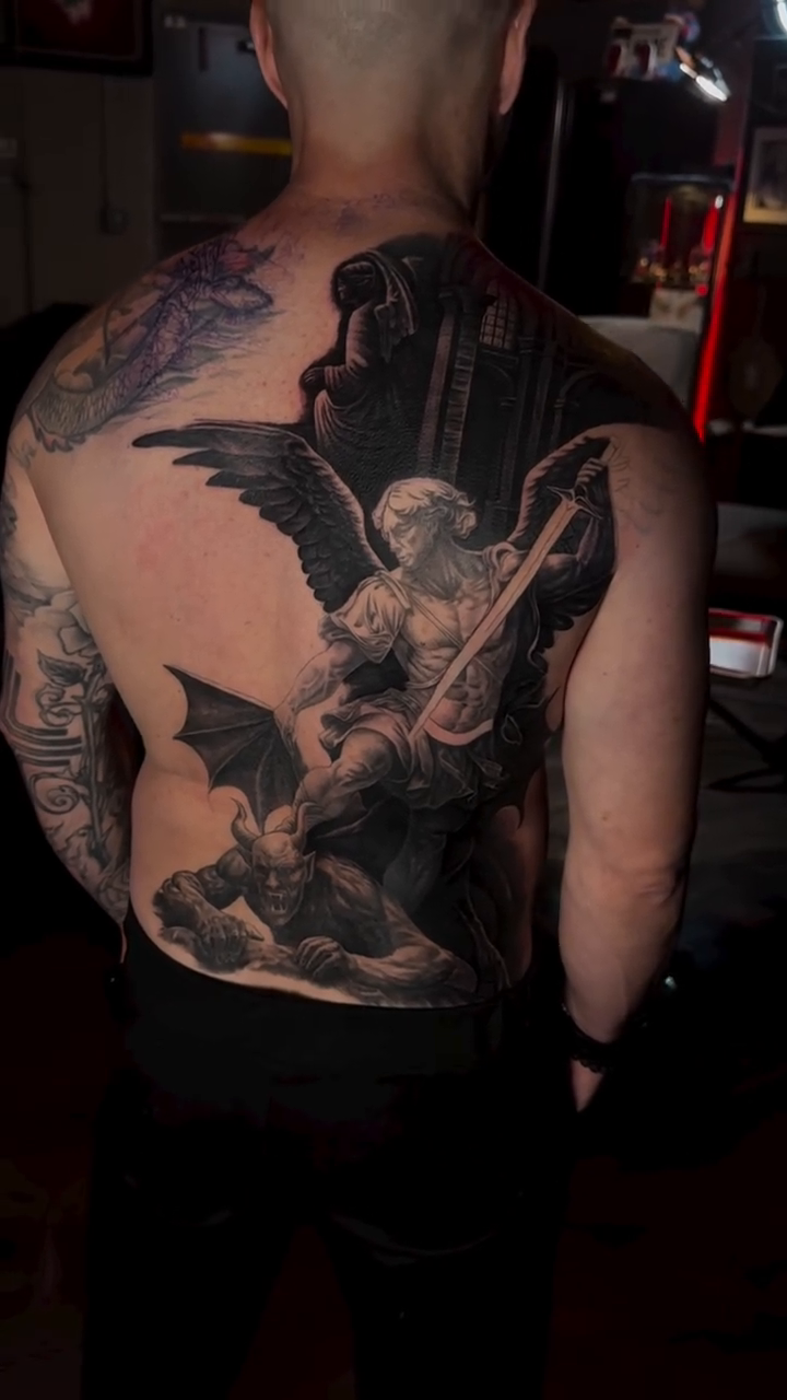 Fallen angel with wings and sword dark realism tattoo by Andrew Wine🍷Tattoo