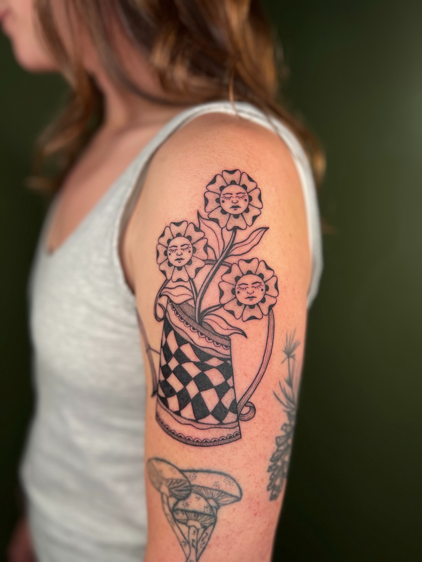 Flower pot with faces black and grey tattoo on the upper arm by ๐ฅ ๐๐ฅ๐๐ฑ๐ข๐ฌ ๐ฅ