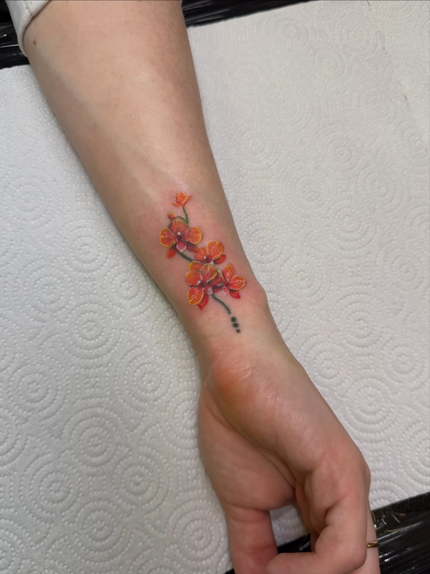 Cherry blossoms dotwork tattoo on the forearm by Dani Fried Tattoos