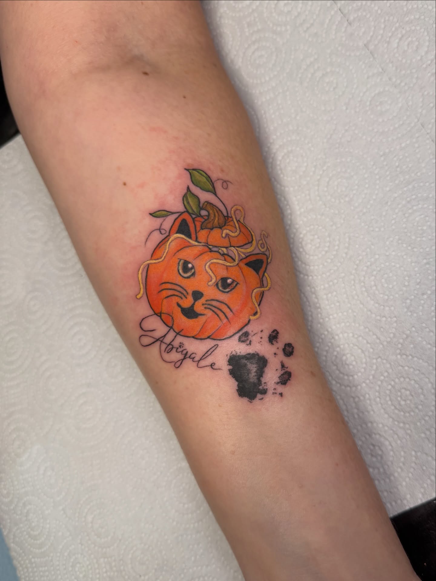 Cat pumpkin dotwork tattoo on the forearm by Dani Fried Tattoos