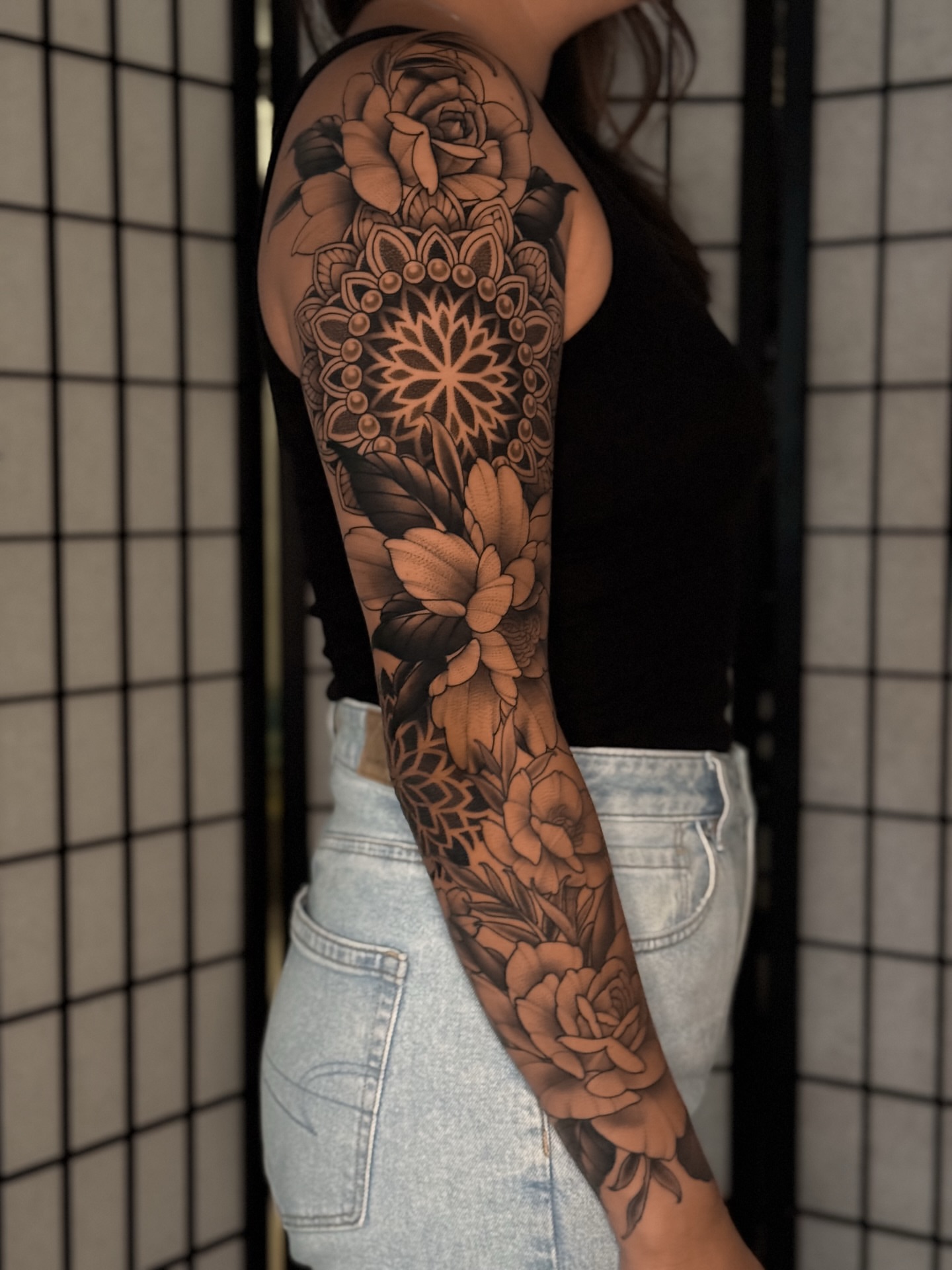 Floral mandala geometric tattoo on the forearm by San Diego
