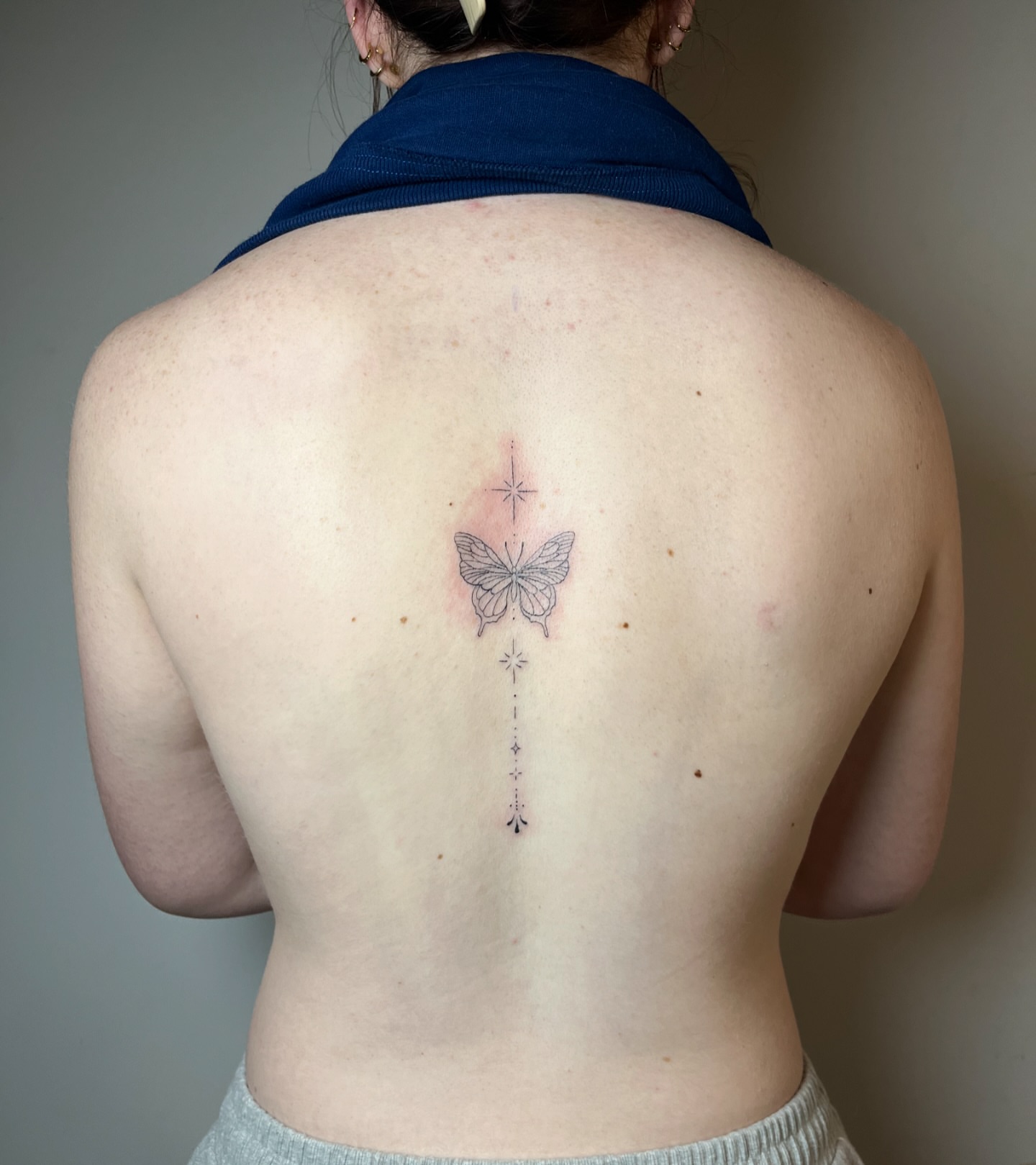 Butterfly fine line tattoo on the back by brinley - fine line tattoos, Crescent Springs, Kentucky