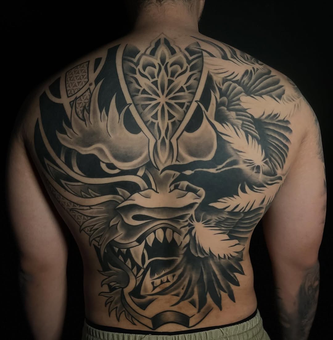 Dragon head Japanese tattoo on the back by Lexi Ross