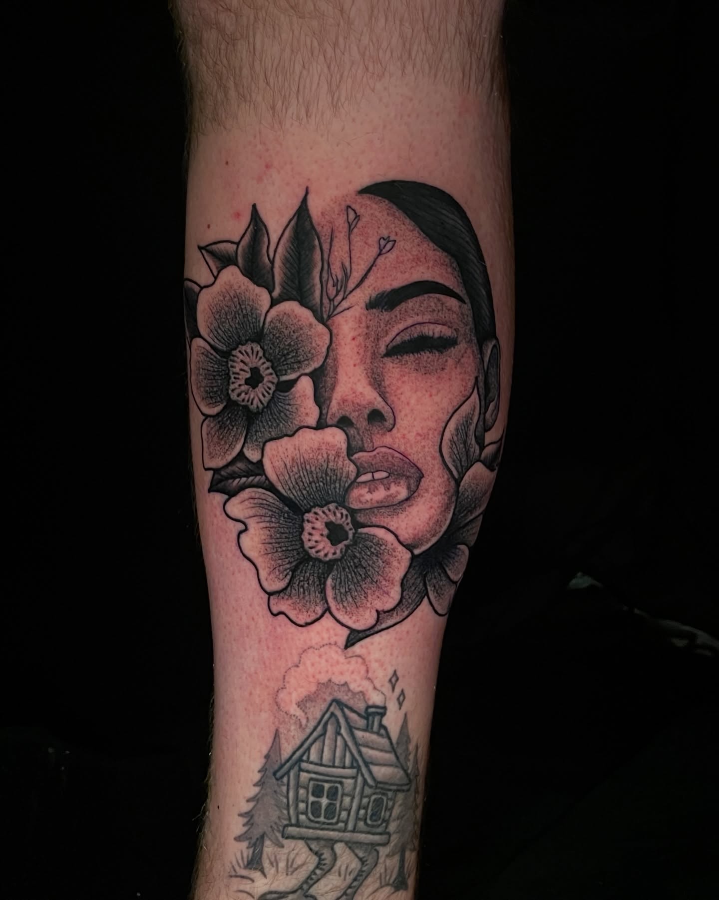 Flower and woman black and grey tattoo on the forearm by Austin Clark