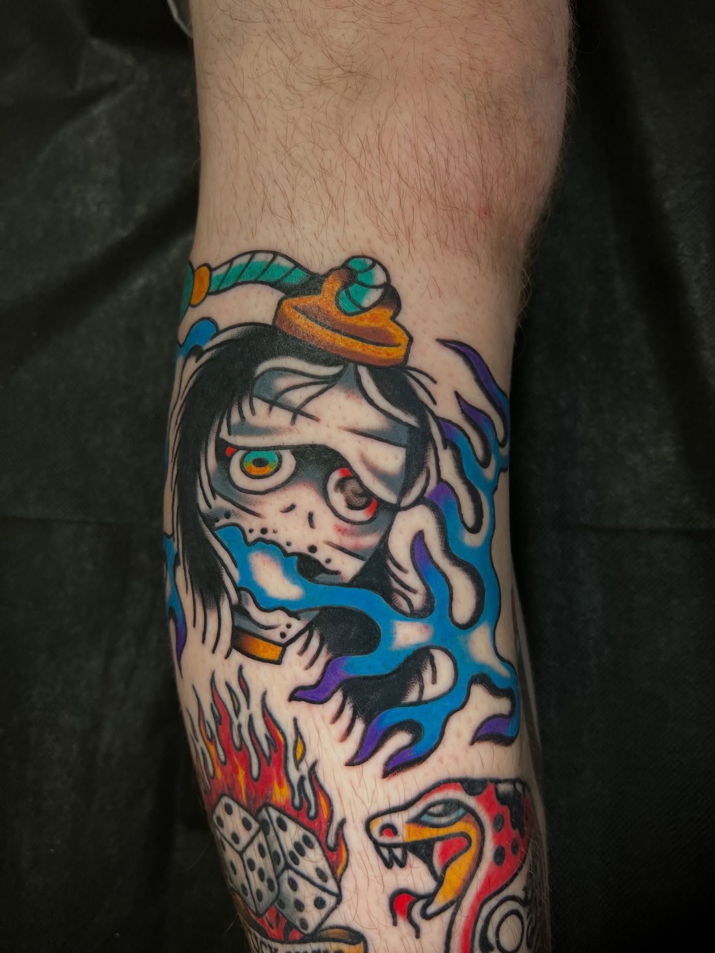 Mask with snake American traditional tattoo on the forearm by 🍊Harvey Perez 🍊, Deerfield Beach, Florida