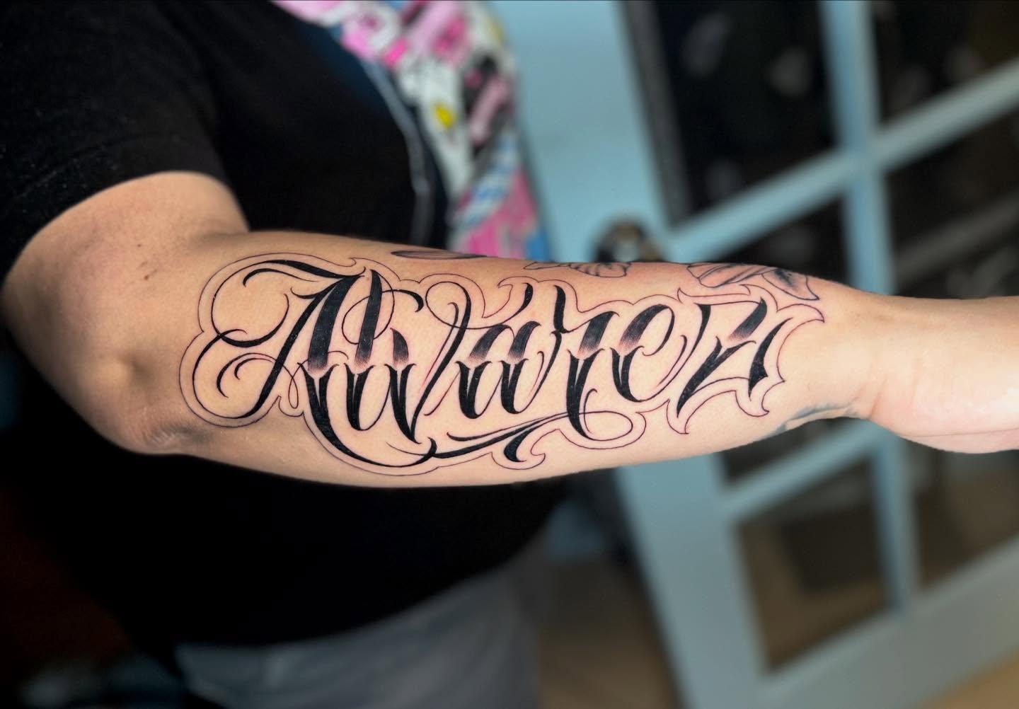 Script lettering lettering script tattoo on the forearm by Stilow Memphis Tattoo Artist, Memphis, Tennessee