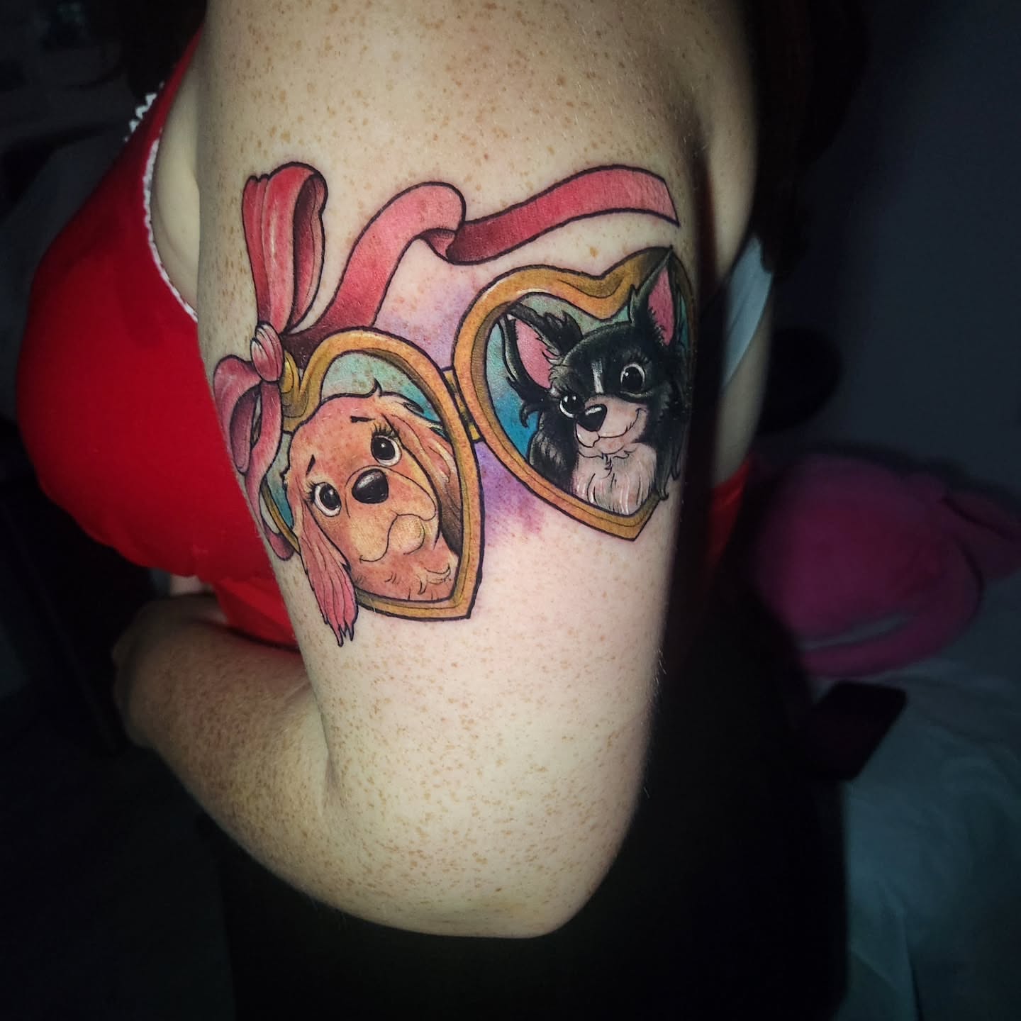 Dog and cat dotwork tattoo on the forearm by Chris Bowen
