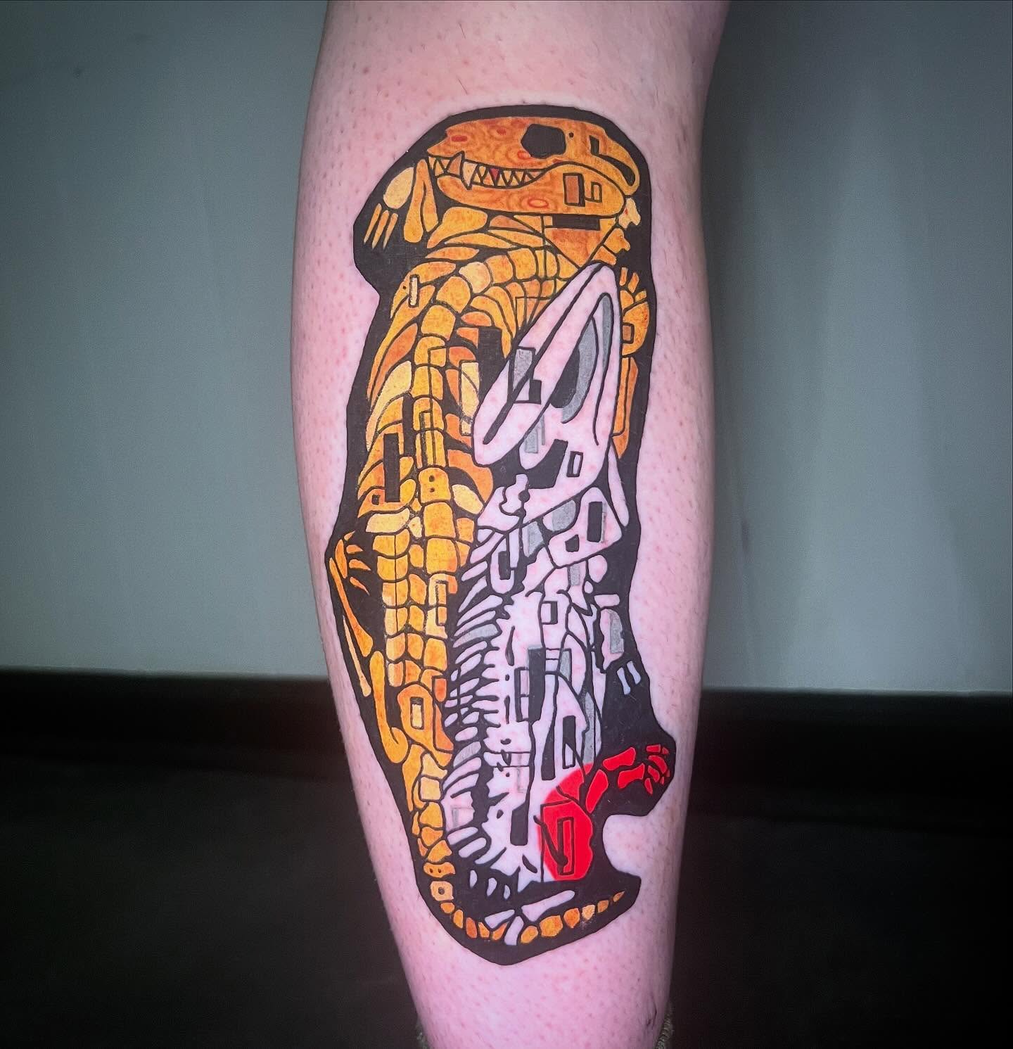 Dinosaur skeleton geometric tattoo on the leg by Taylor Estrella