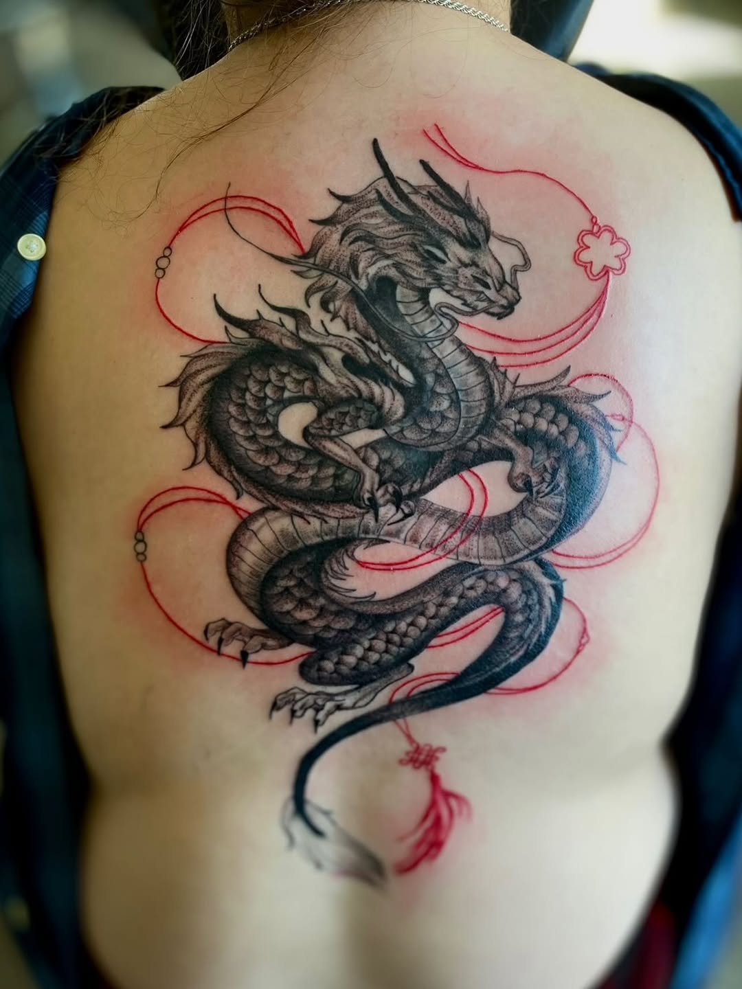 Dragon with red accents Japanese tattoo on the back by Jelani