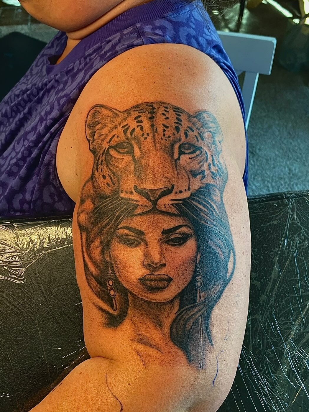 Woman with leopard headdress realism tattoo on the shoulder by Jelani