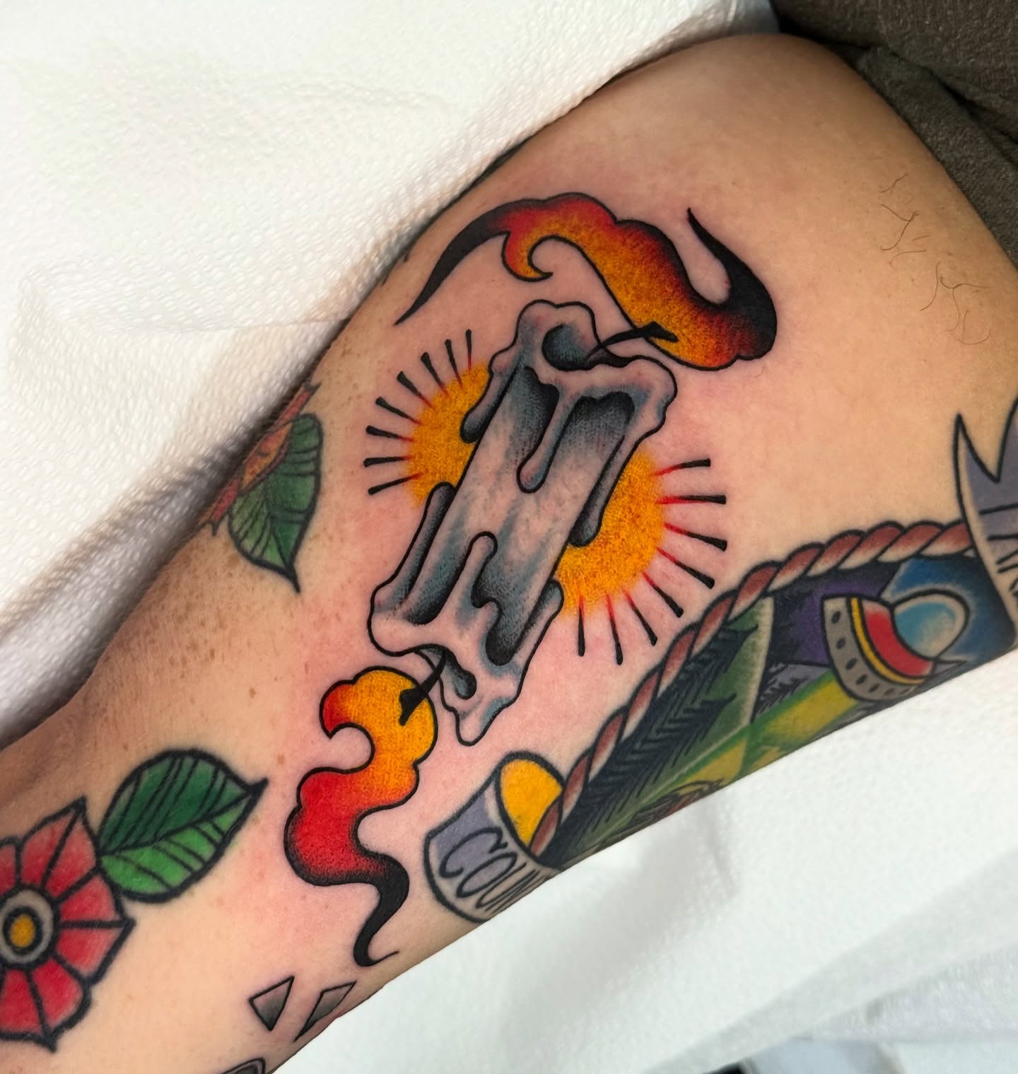 Burning candle American traditional tattoo on the forearm by Chelstine, Encinitas, California
