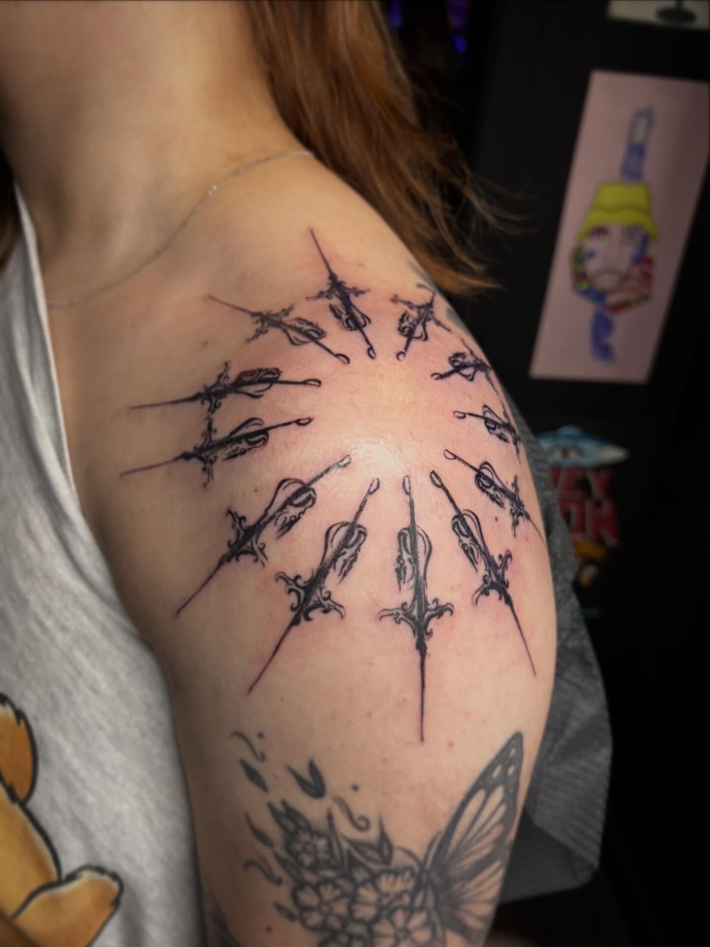Violin black and grey tattoo on the shoulder by Haley Byers