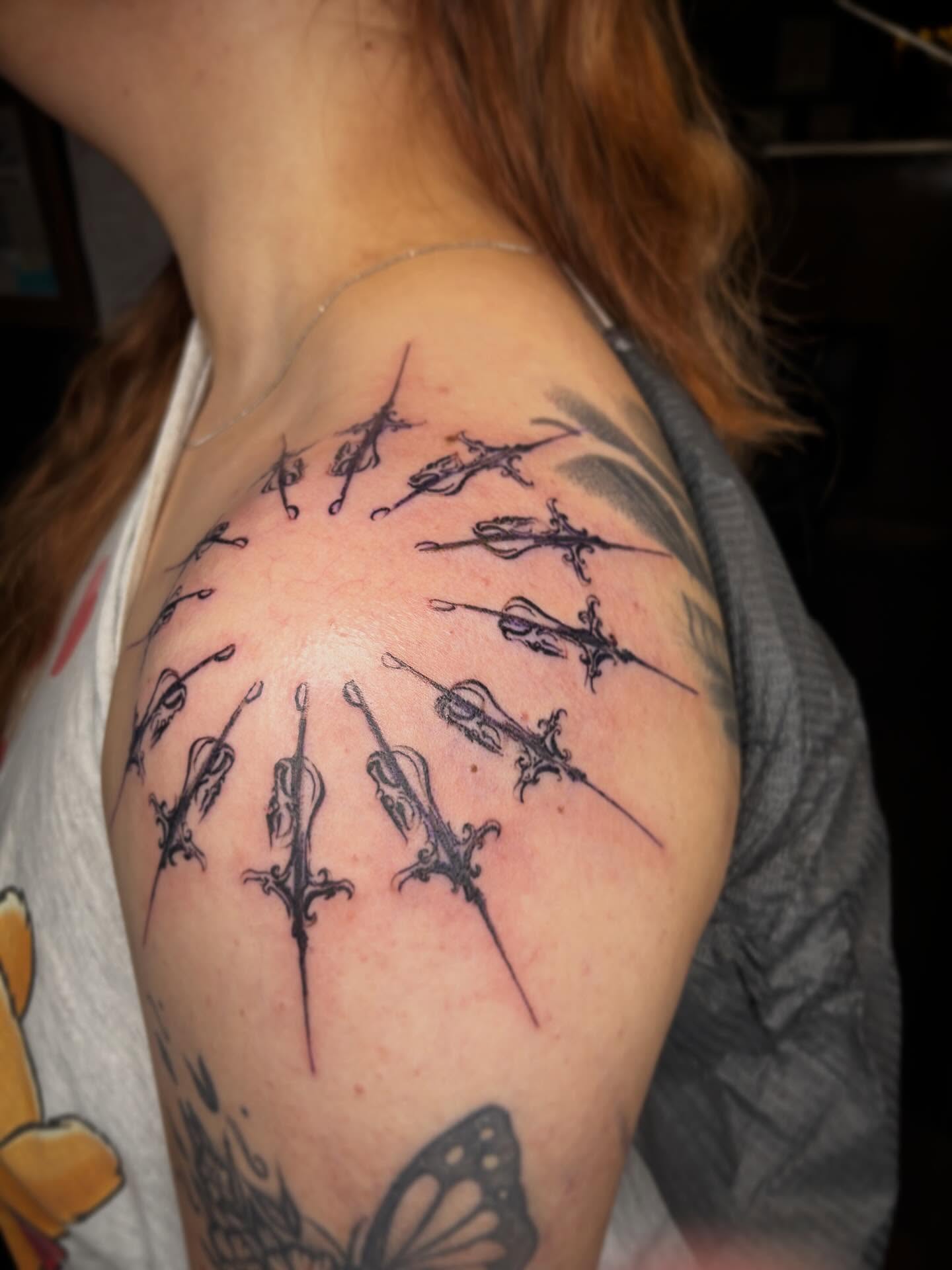 Violin black and grey tattoo on the shoulder by Haley Byers
