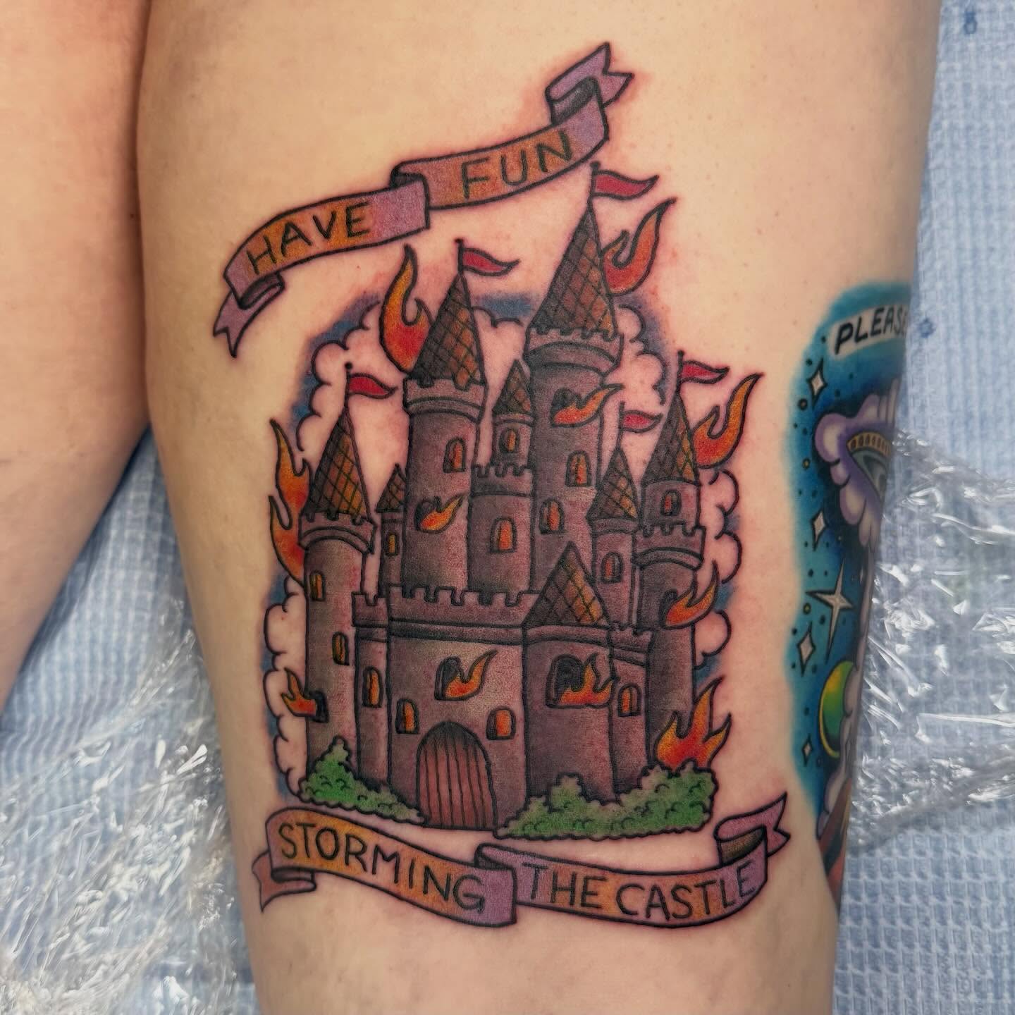 Castle American traditional tattoo on the thigh by Sue Garcia