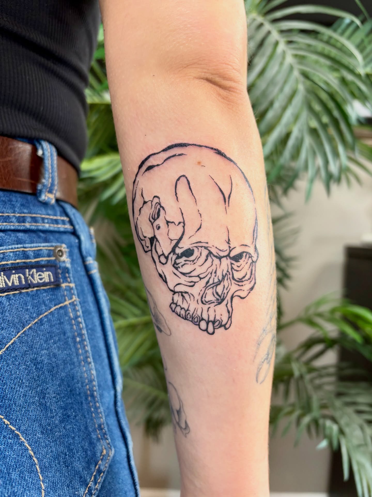 Skull realism tattoo on the forearm by Taylor Heidtbrink