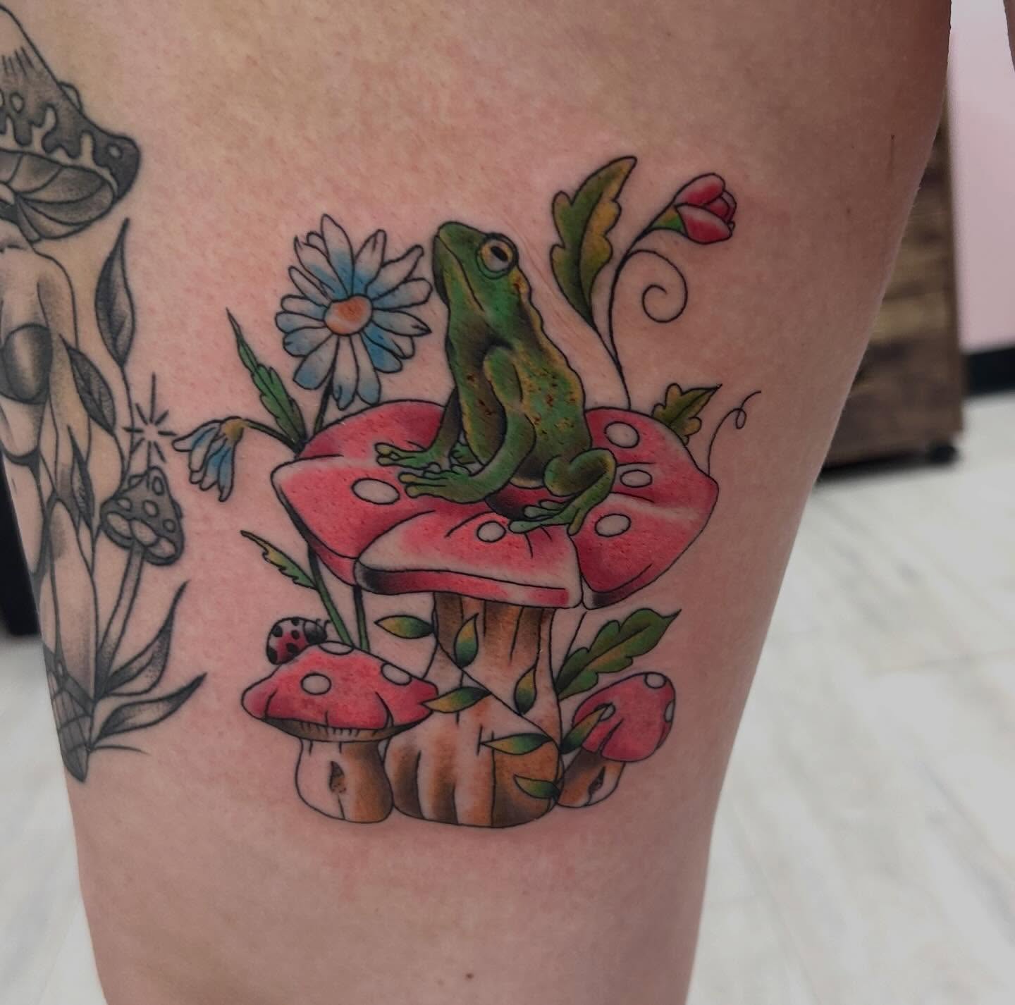 Frog on mushrooms new school tattoo on the thigh by Red✨, Gansevoort, New York
