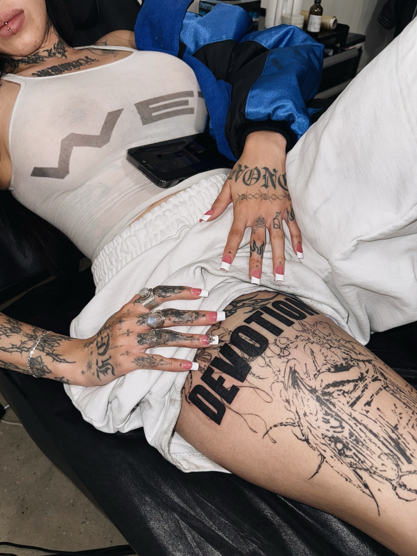 Devotion black and grey tattoo on the thigh by viktoria raquel
