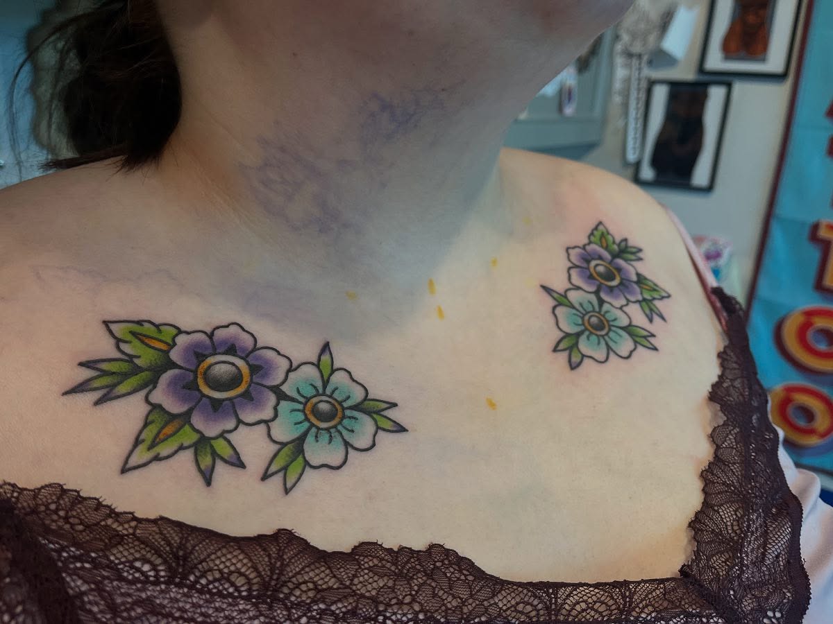 Floral arrangement American traditional tattoo on the chest by 🖤Jess Pereira🖤, Framingham, Massachusetts