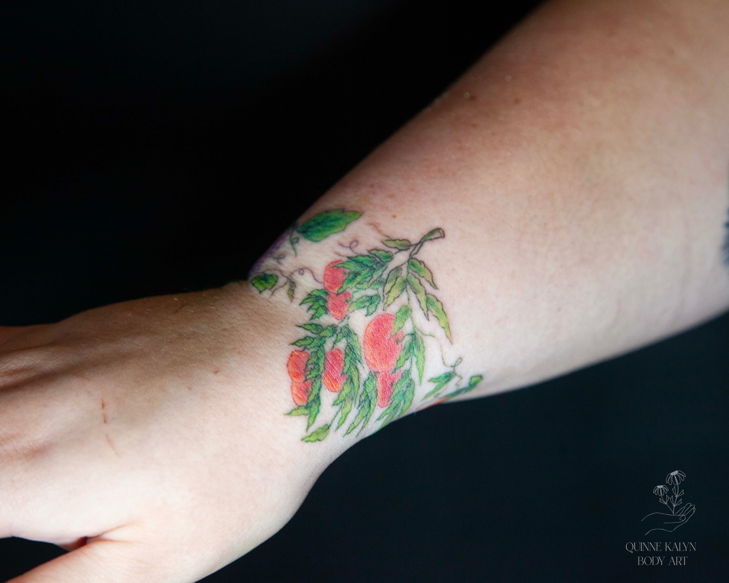 Peaches and leaves realism tattoo on the forearm by Nashville Piercer & Tattoo Artist ✨ Quinne