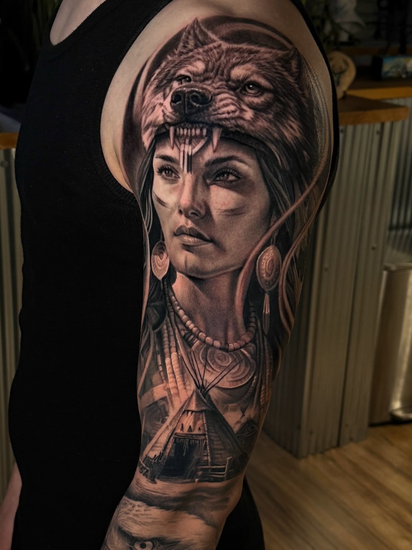 Woman with wolf realism tattoo on the forearm by Aaron, Milwaukee, Wisconsin