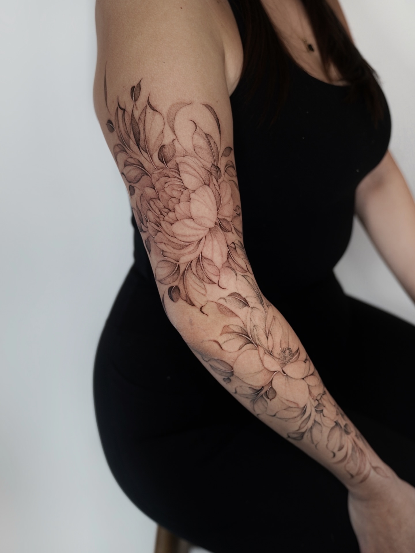 Floral bouquet black and grey tattoo on the forearm by Bel Fernandez