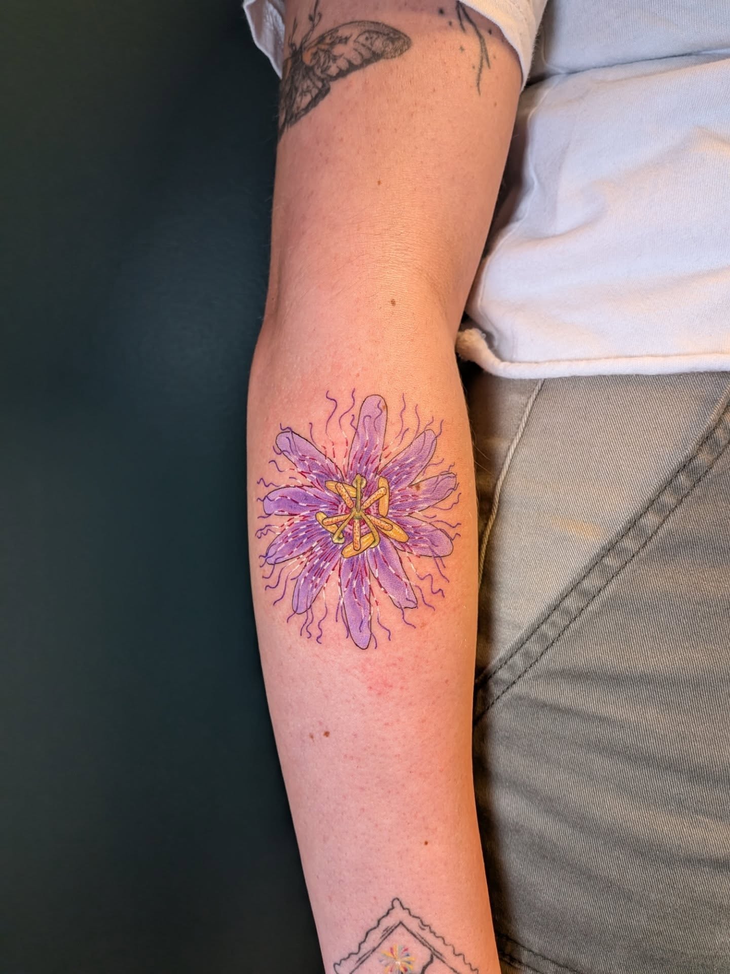 Passion flower watercolor tattoo on the forearm by L U C y, Knoxville, Tennessee