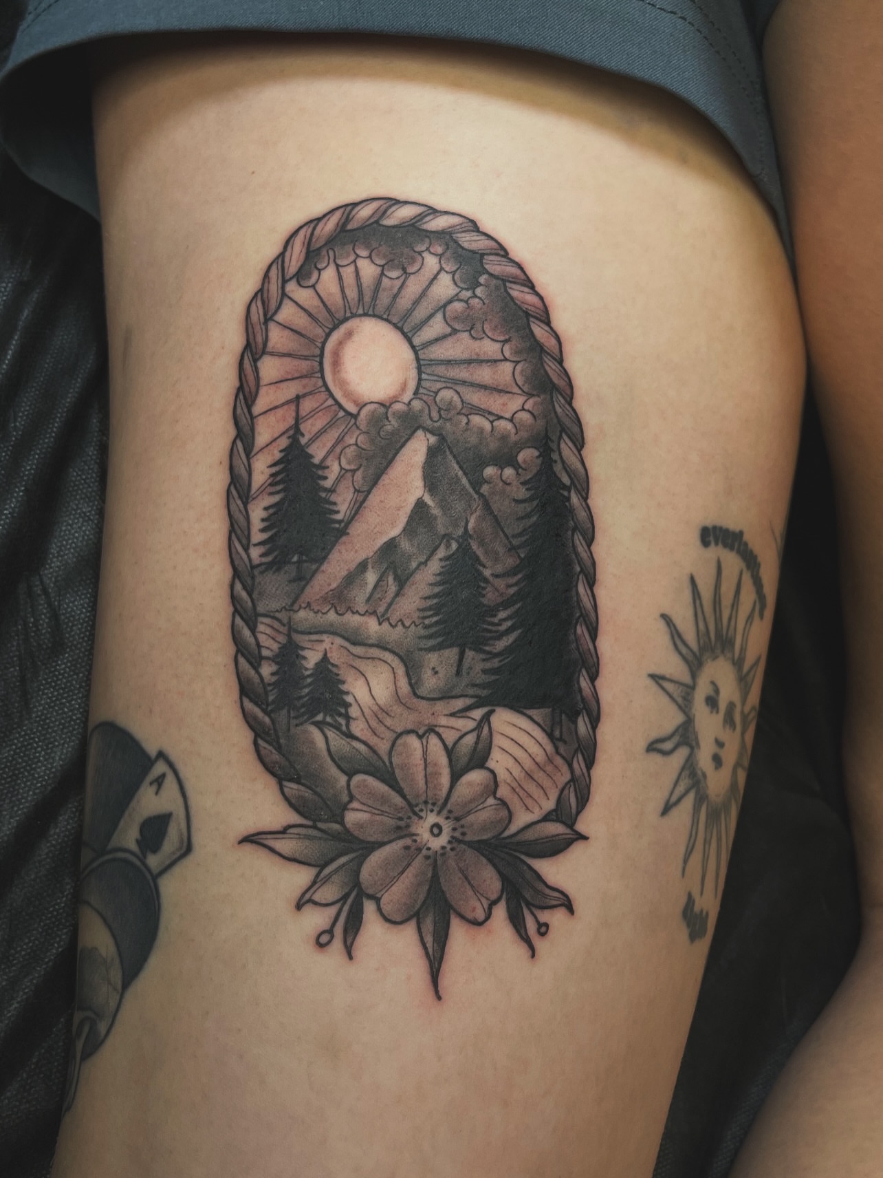 Mountain and sun black and grey tattoo on the thigh by ๐ต๐๐๐ ๐ฐ๐๐๐