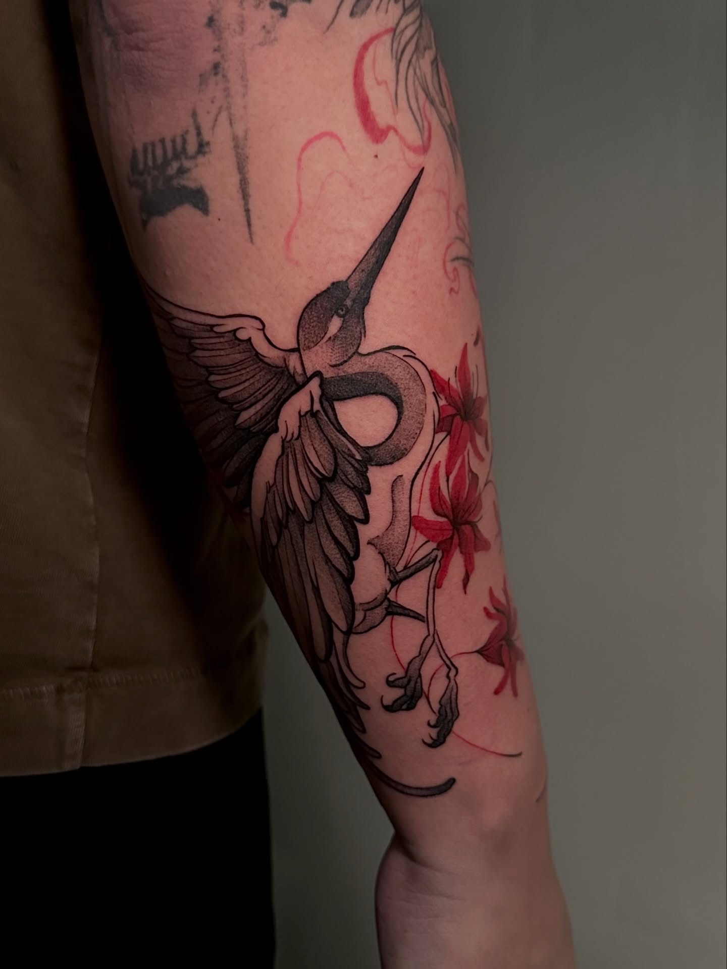 Heron and flowers black and grey tattoo on the forearm by Crystal, Las Vegas, Nevada
