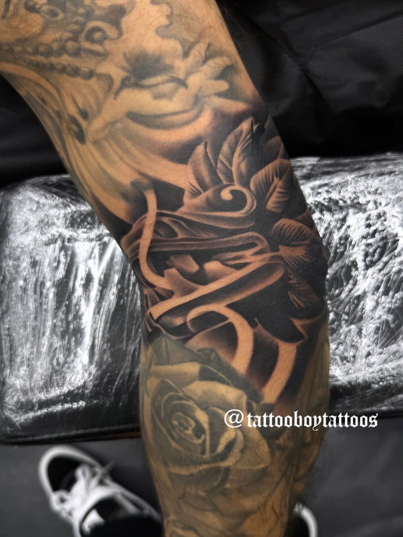 Rose and calligraphy realism tattoo on the forearm by TattooBoyTattoos