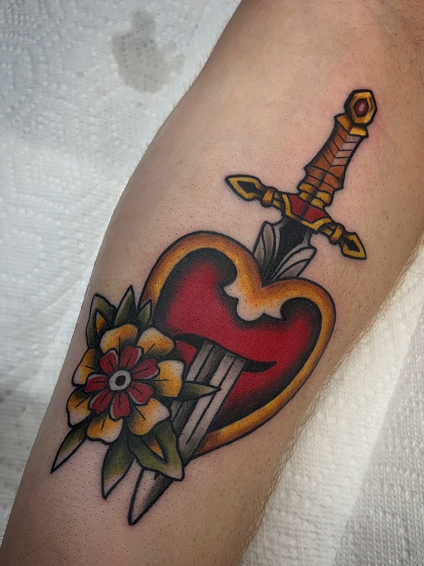 Heart and dagger American traditional tattoo on the forearm by 𝑴𝒂𝒚𝒂𖤐𝑫𝒆𝑽𝒊𝒏𝒆, Dayton, Ohio