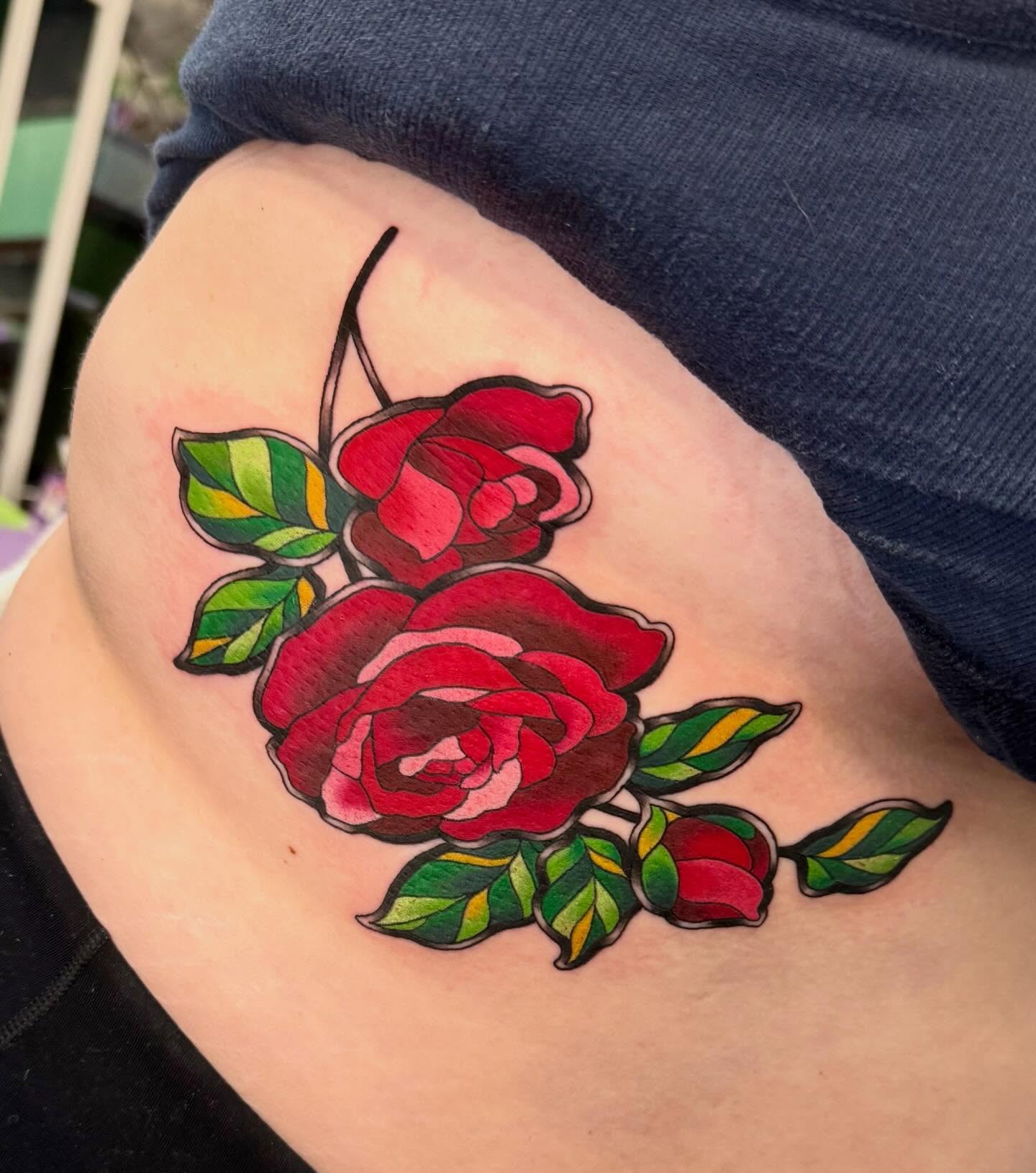 Red roses American traditional tattoo on the thigh by Taylor Kay 🌿