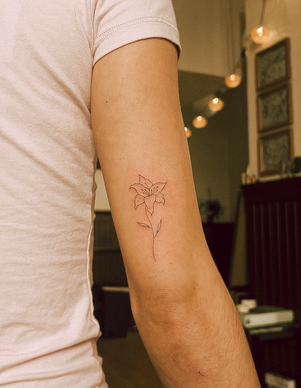 Flower fine line tattoo on the forearm by chloe ☼, Tacoma, Washington