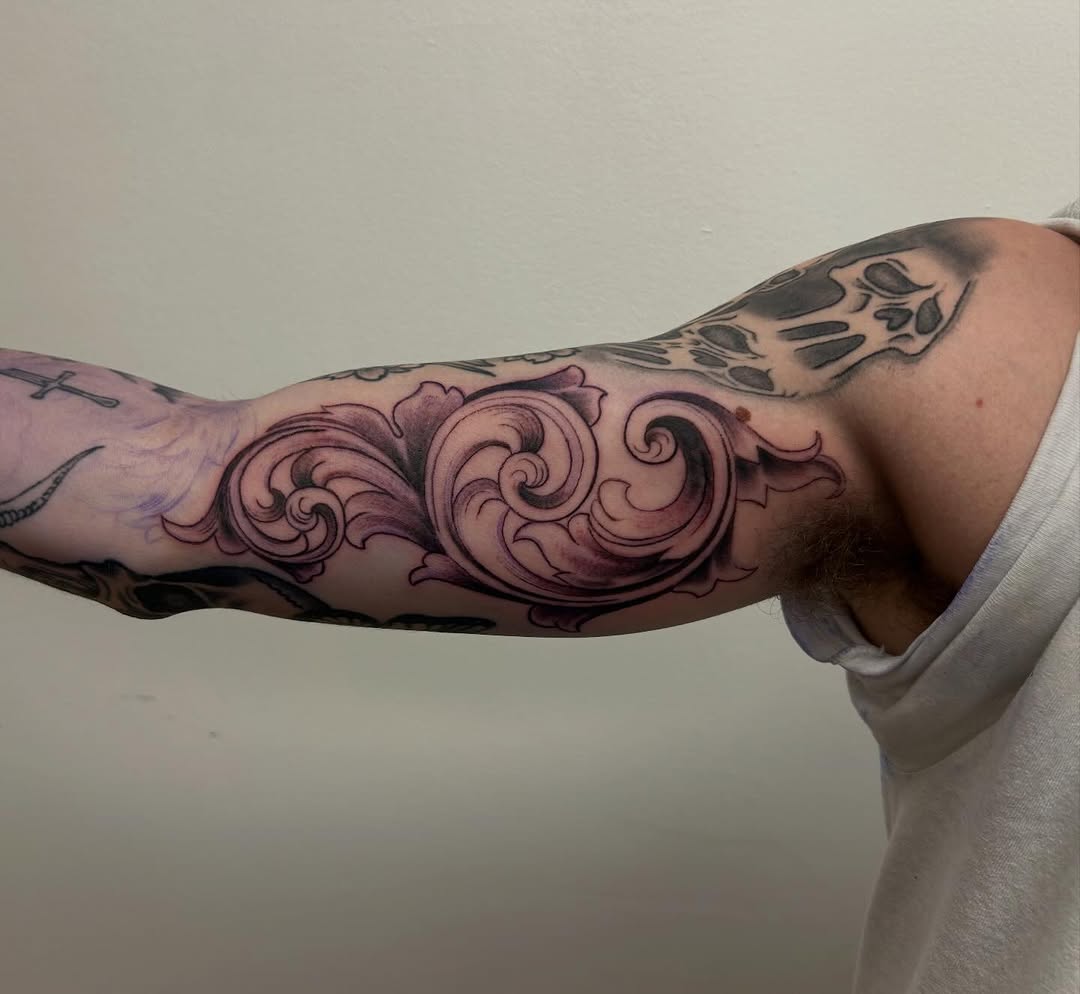 Ornamental scrollwork ornamental tattoo on the forearm by Chris