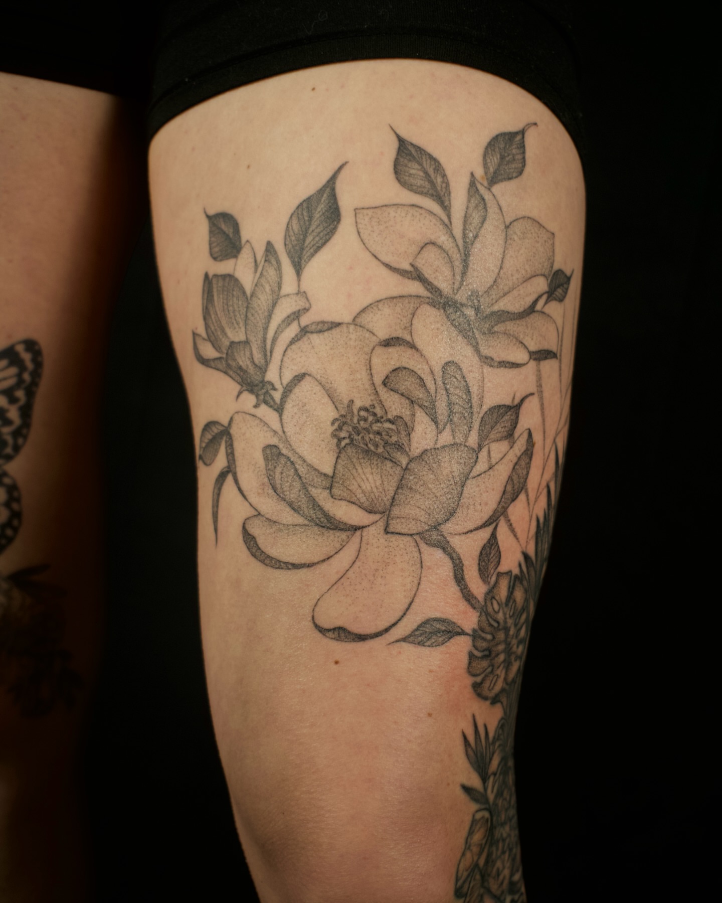 Flower black and grey tattoo on the thigh by Kevin Rotramel, Dayton, Ohio