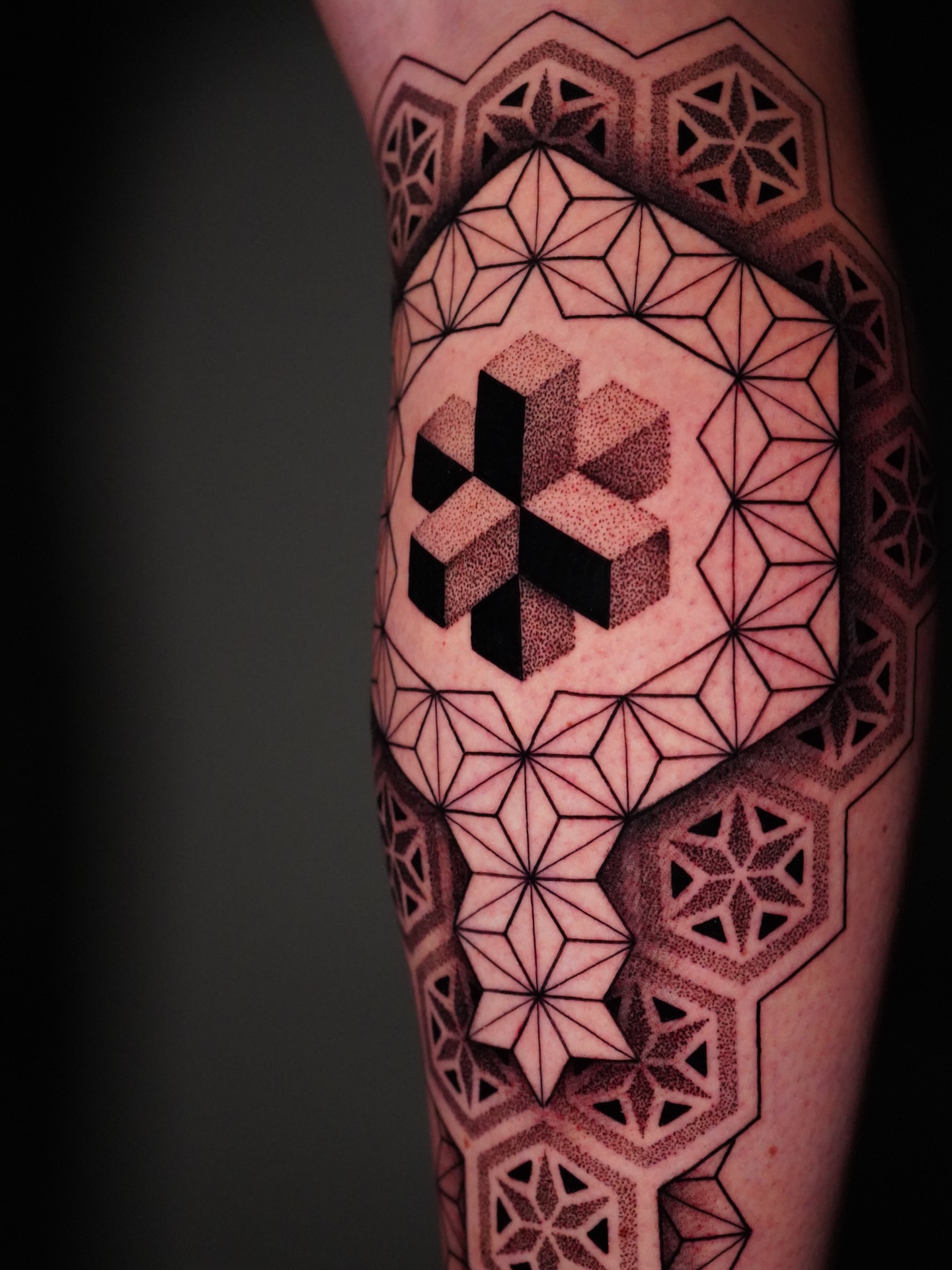 Geometric pattern dotwork tattoo on the forearm by Jason Call
