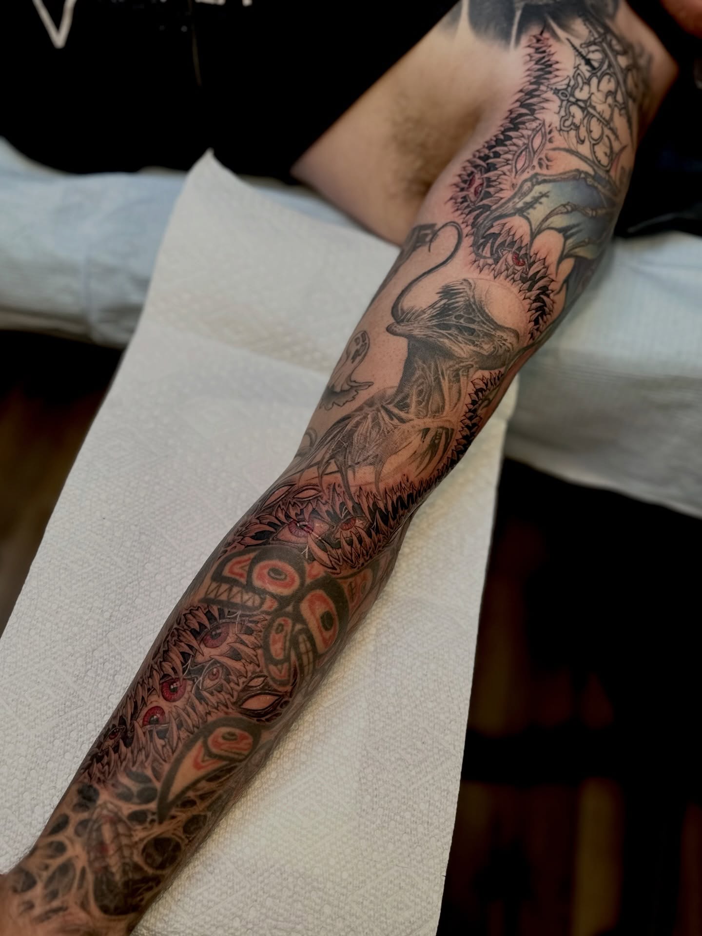 Abstract floral dotwork tattoo on the forearm by Ghost
