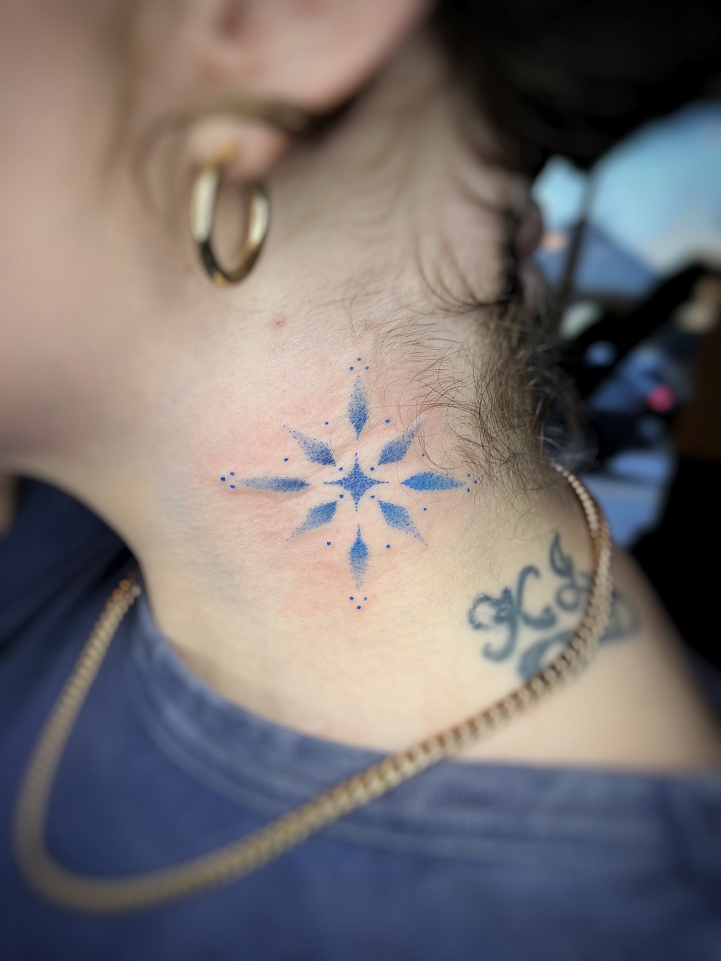 Geometric star dotwork tattoo on the neck by Risa Cincinnati Tattoo Artist