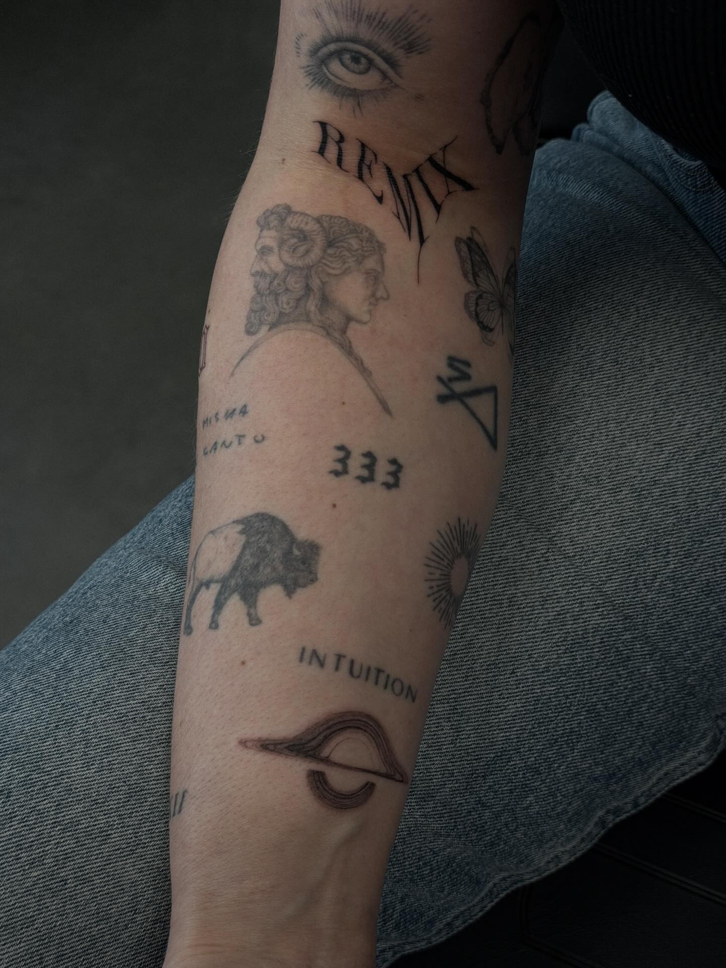 Spiritual symbols geometric tattoo on the forearm by Hannah Matthews