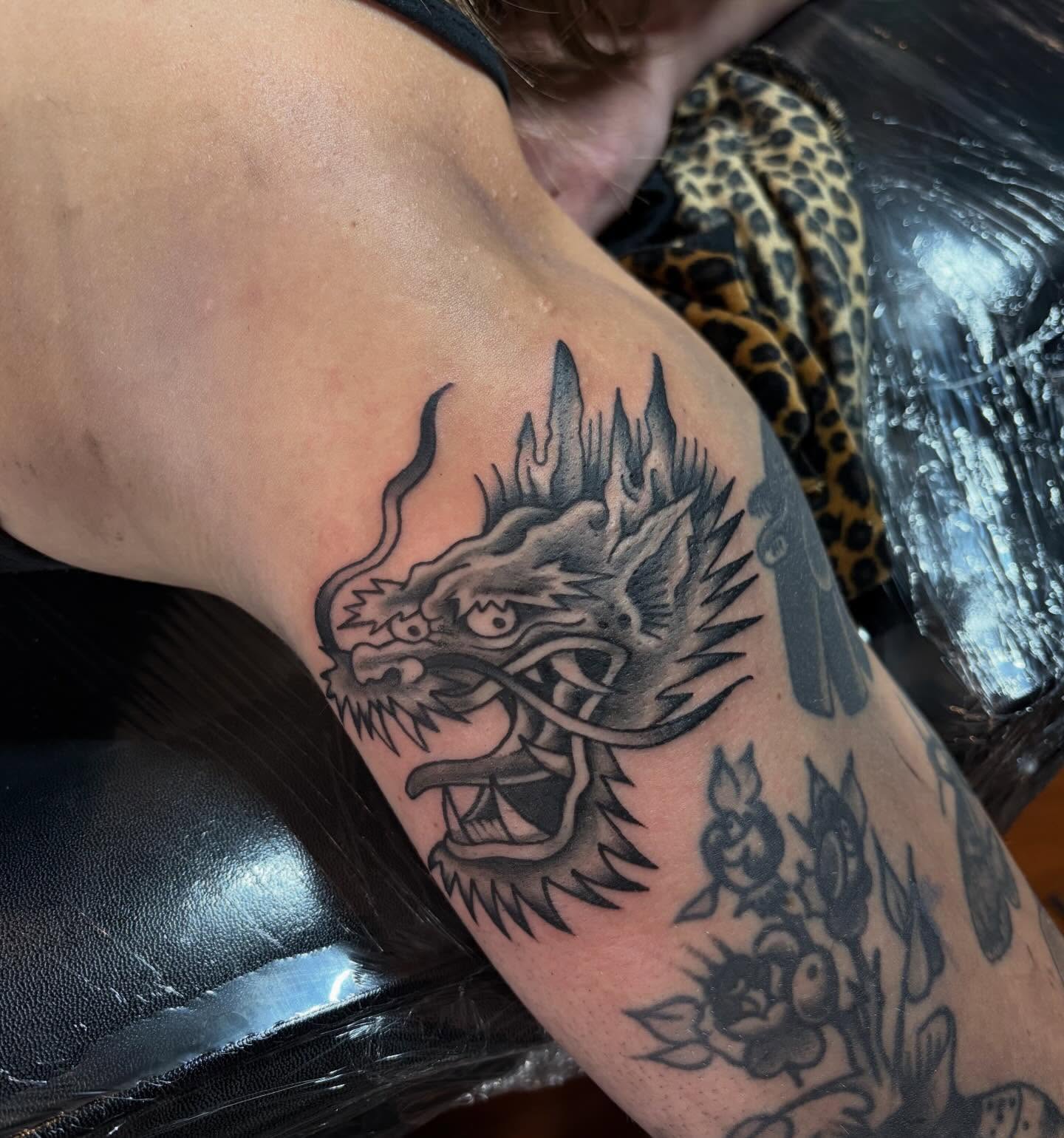 Dragon black and grey tattoo on the forearm by Ady Paige