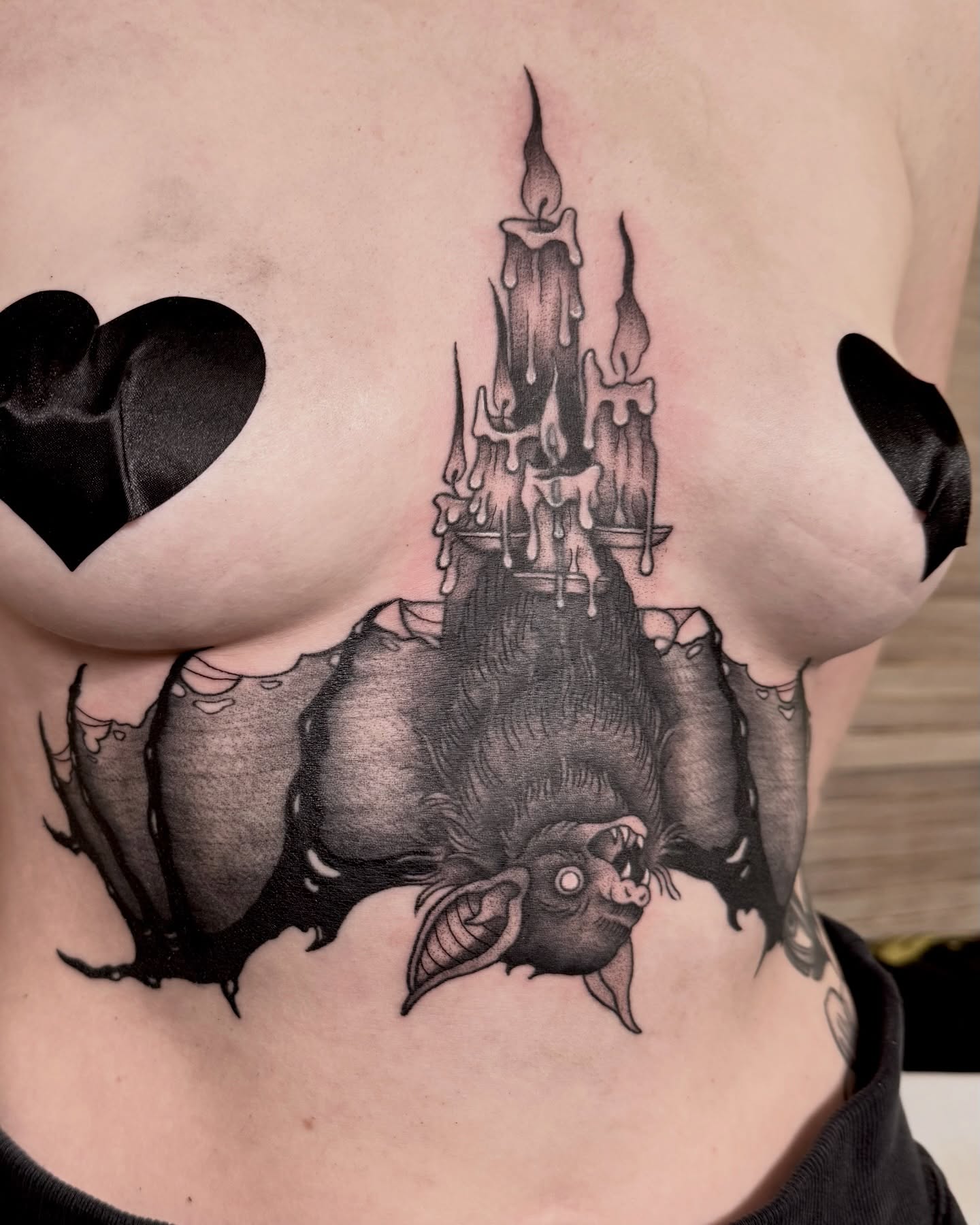 Candle castle dark realism tattoo on the chest by Eden Allen