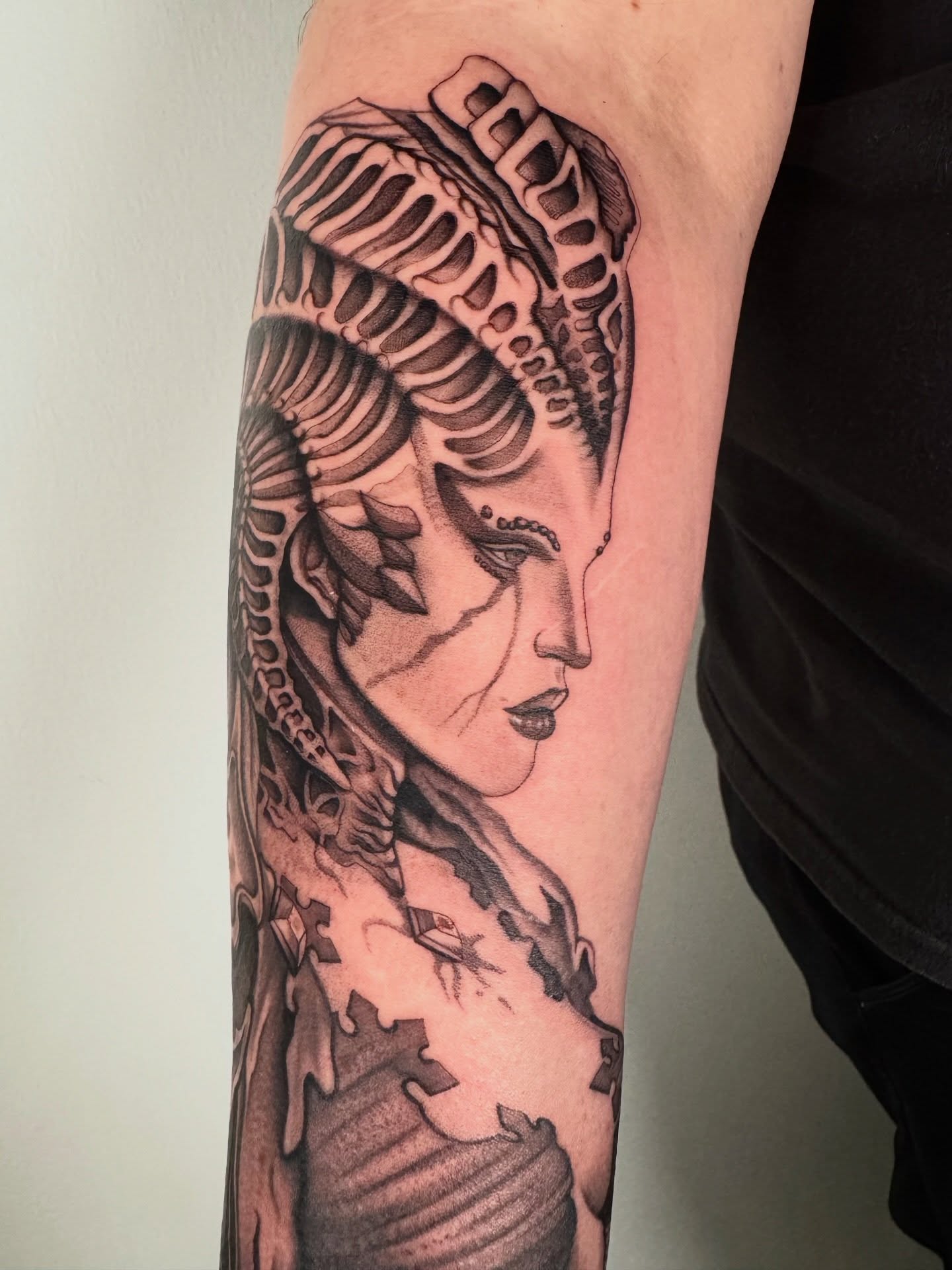Woman with biomechanical head geometric tattoo on the forearm by Austin Tattoo Artist, Austin, Texas